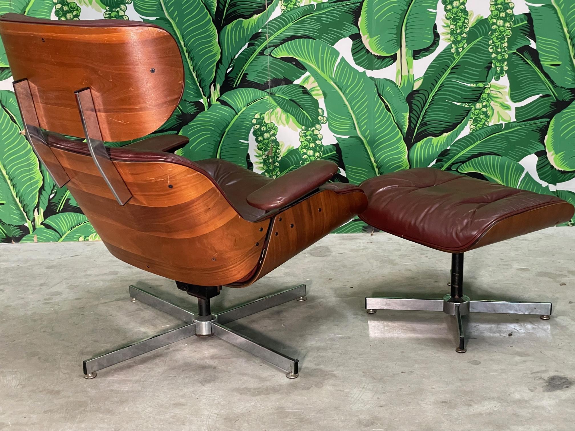 Eames Style Leather Lounge Chair and Ottoman in Oxblood In Fair Condition In Jacksonville, FL