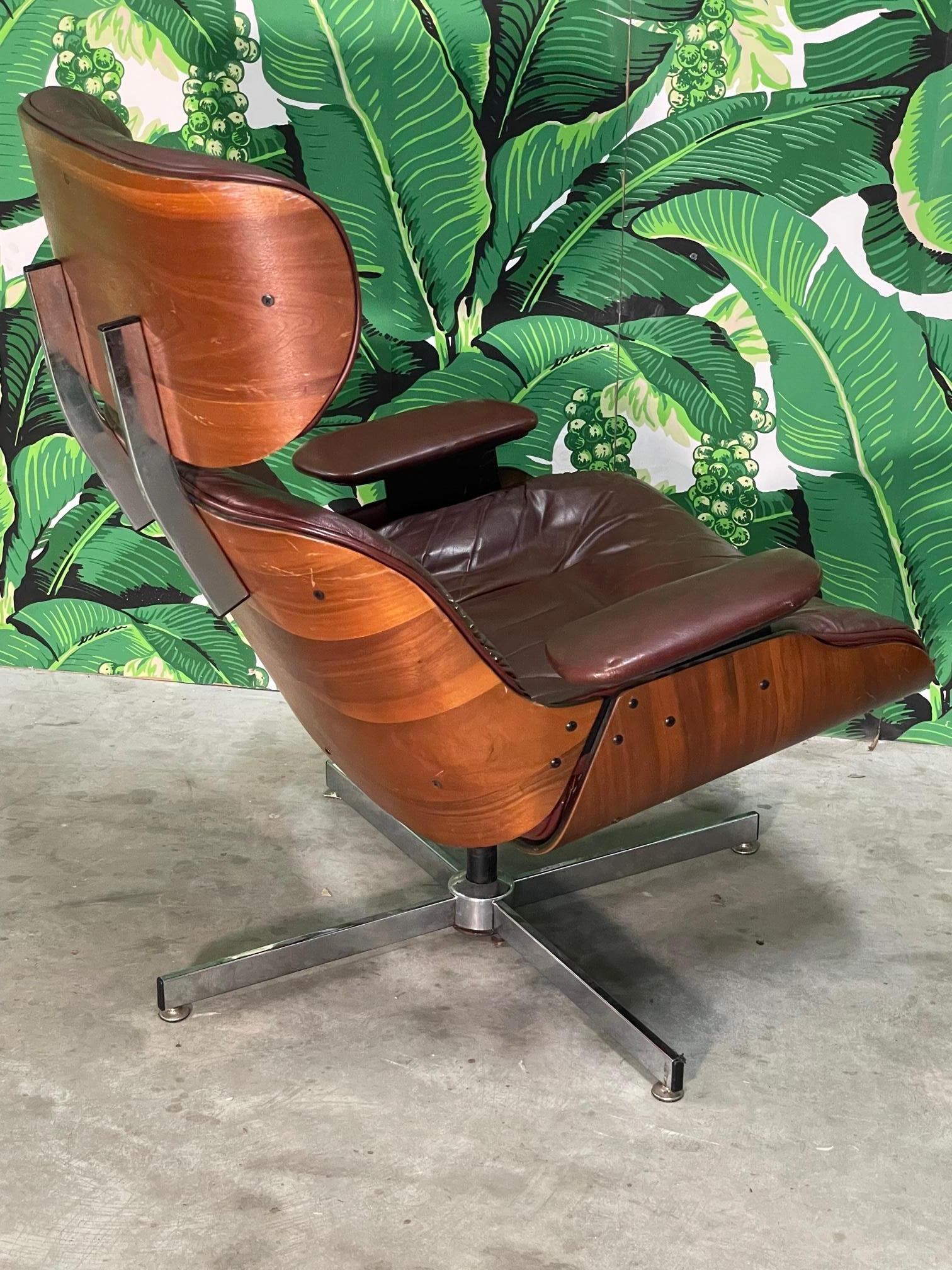 20th Century Eames Style Leather Lounge Chair and Ottoman in Oxblood