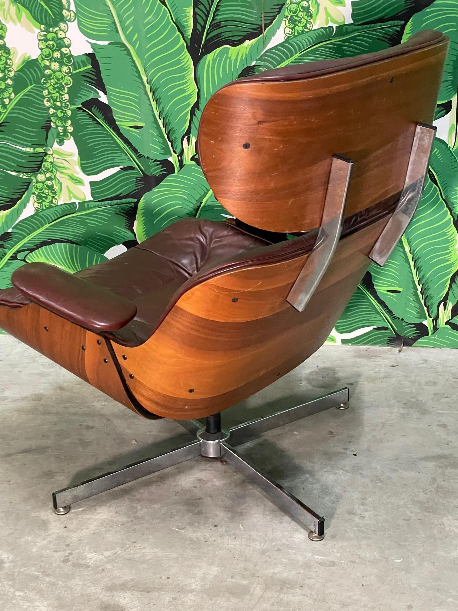 Metal Eames Style Leather Lounge Chair and Ottoman in Oxblood