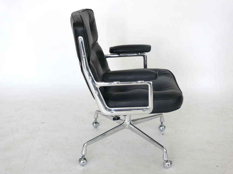 Classic office chair from the Time Life building in New York. Designed by Eames featuring newly upholstered black leather, new casters and a newly polished chrome base and frame. Chair is height adjustable with tilt and swivel.
