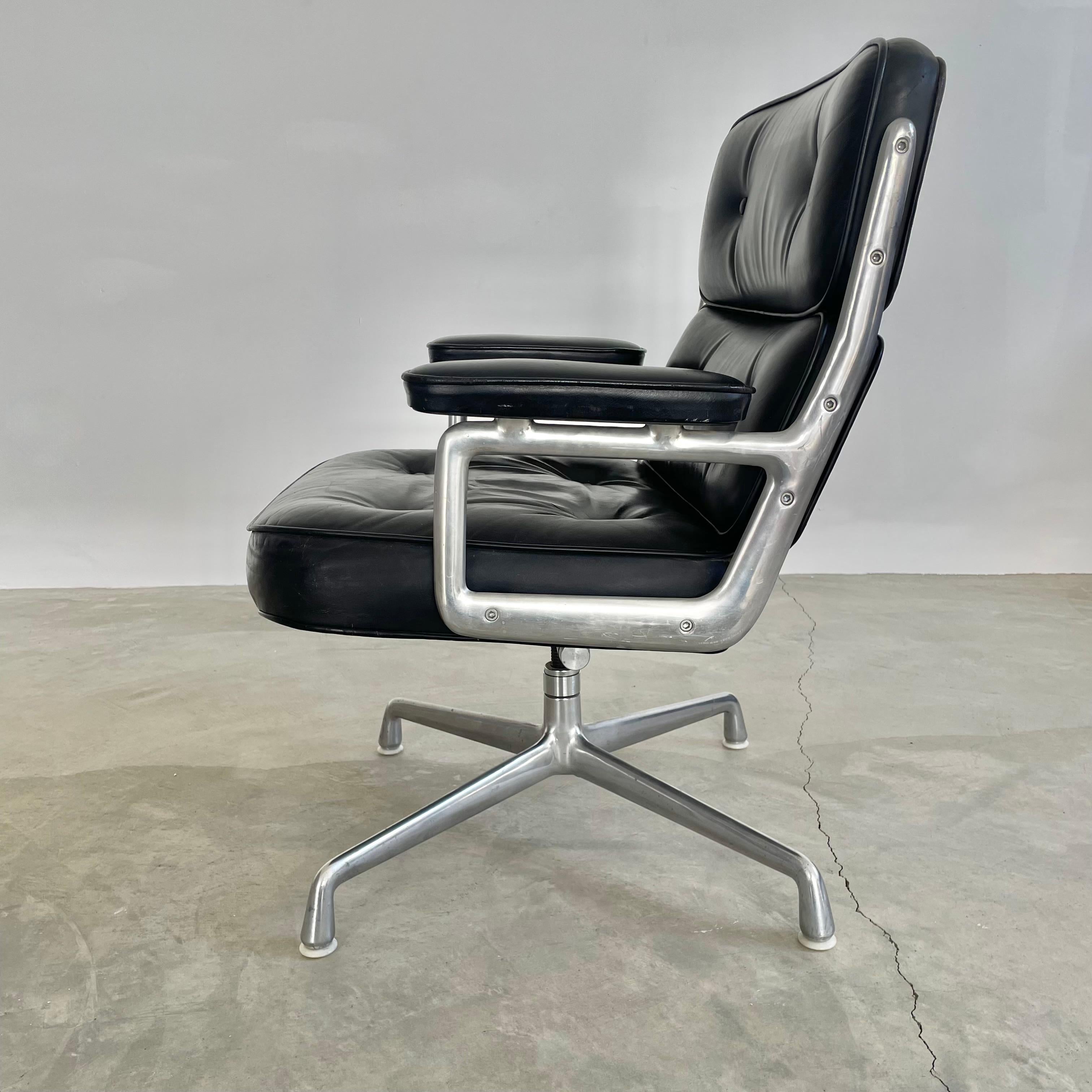 Classic Eames Time Life swivel chair in black leather for Herman Miller. Original black leather with wear as shown. Extremely comfortable and worn in. Chair swivels. Chair reclines. Height is adjustable. Original Herman Miller tag underneath.