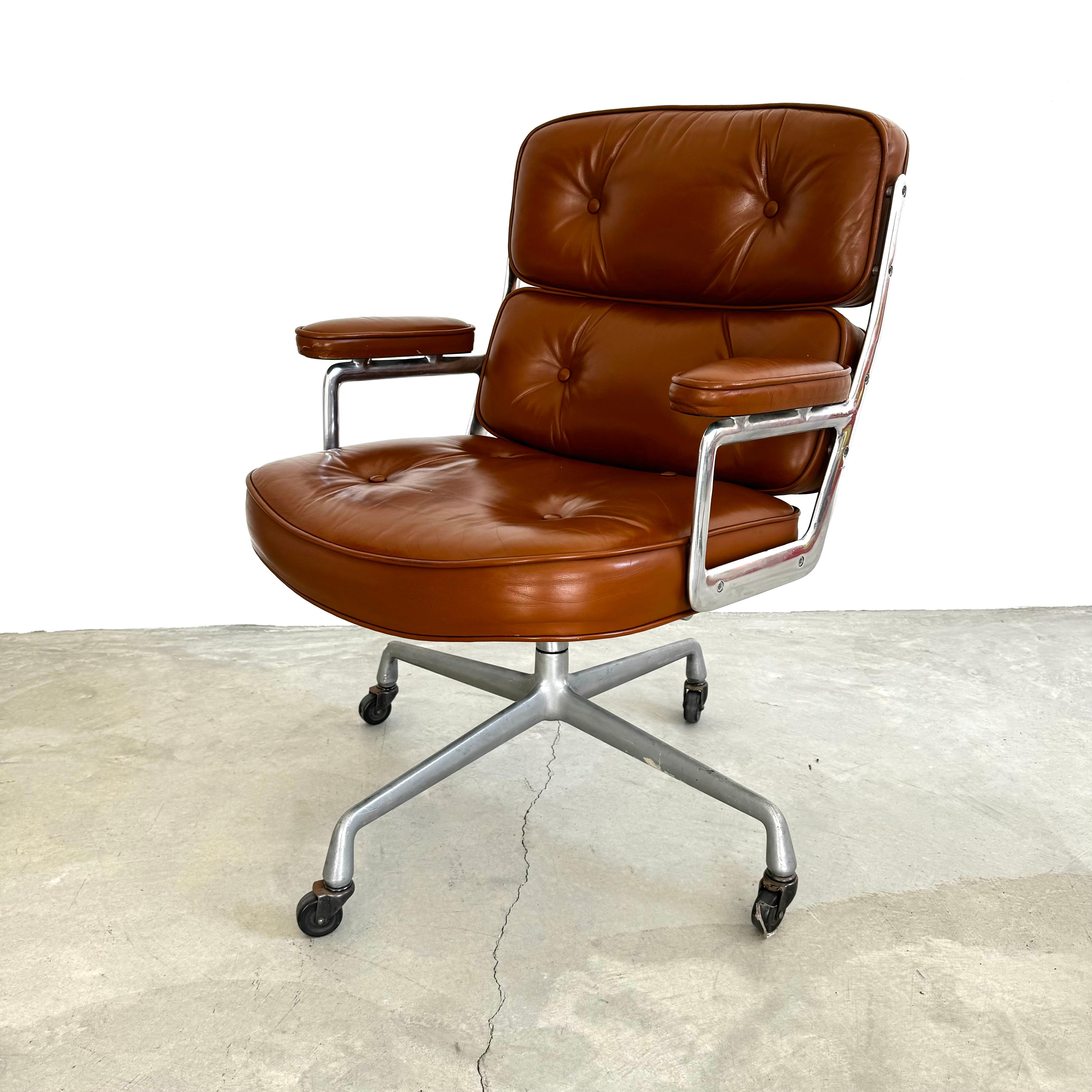 Classic Eames Time Life swivel chair in butterscotch colored leather for Herman Miller. Original leather with wear as shown. Extremely comfortable and worn in. Chair swivels. Chair reclines. Height is adjustable. 4 star base. Original Herman Miller