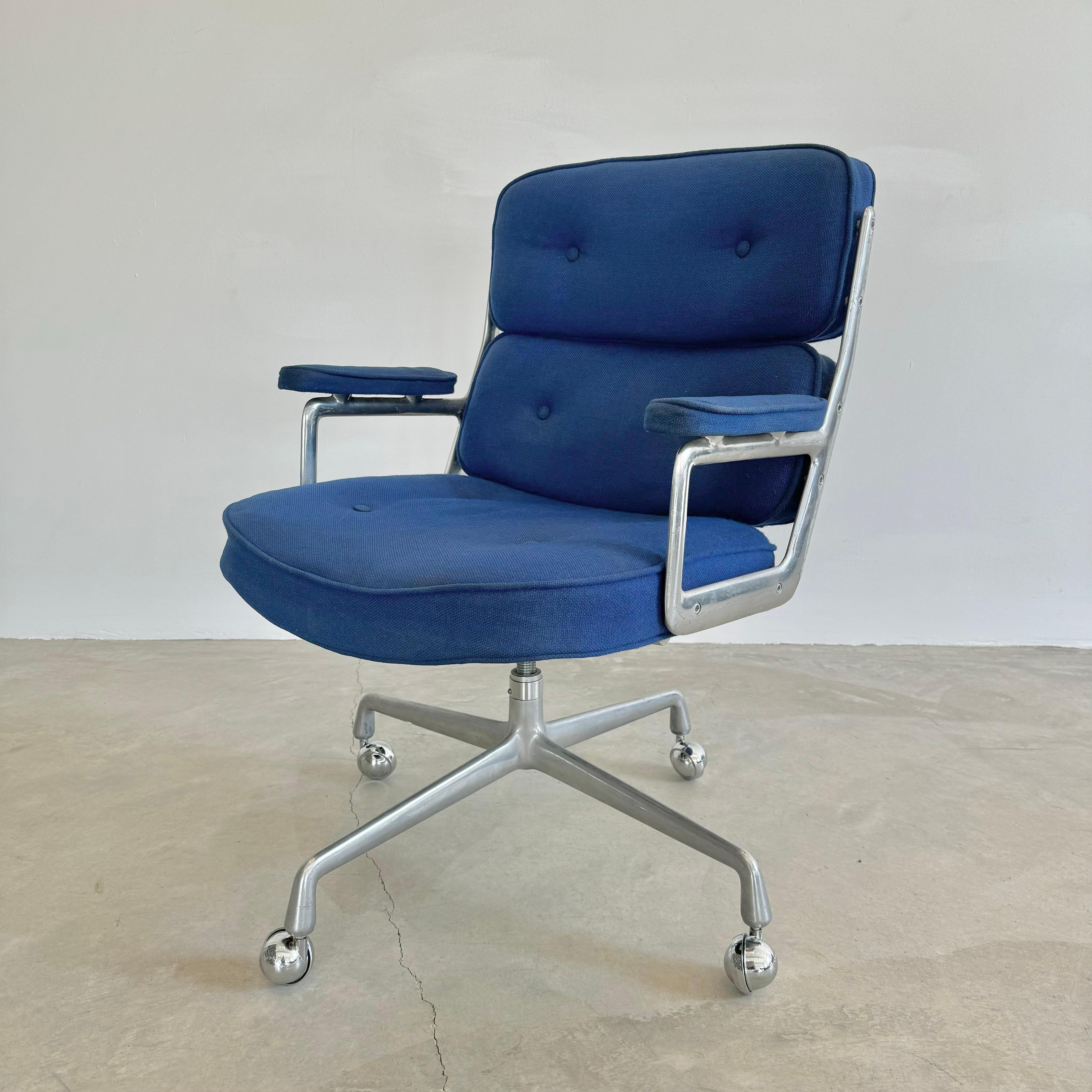 Classic Eames Time Life swivel chair for Herman Miller in rarely seen original navy blue burlap upholstery from the now defunct Trojan Nuclear Plant in Oregon, USA. Chair swivels and reclines and is height adjustable. Metal and burlap are in good