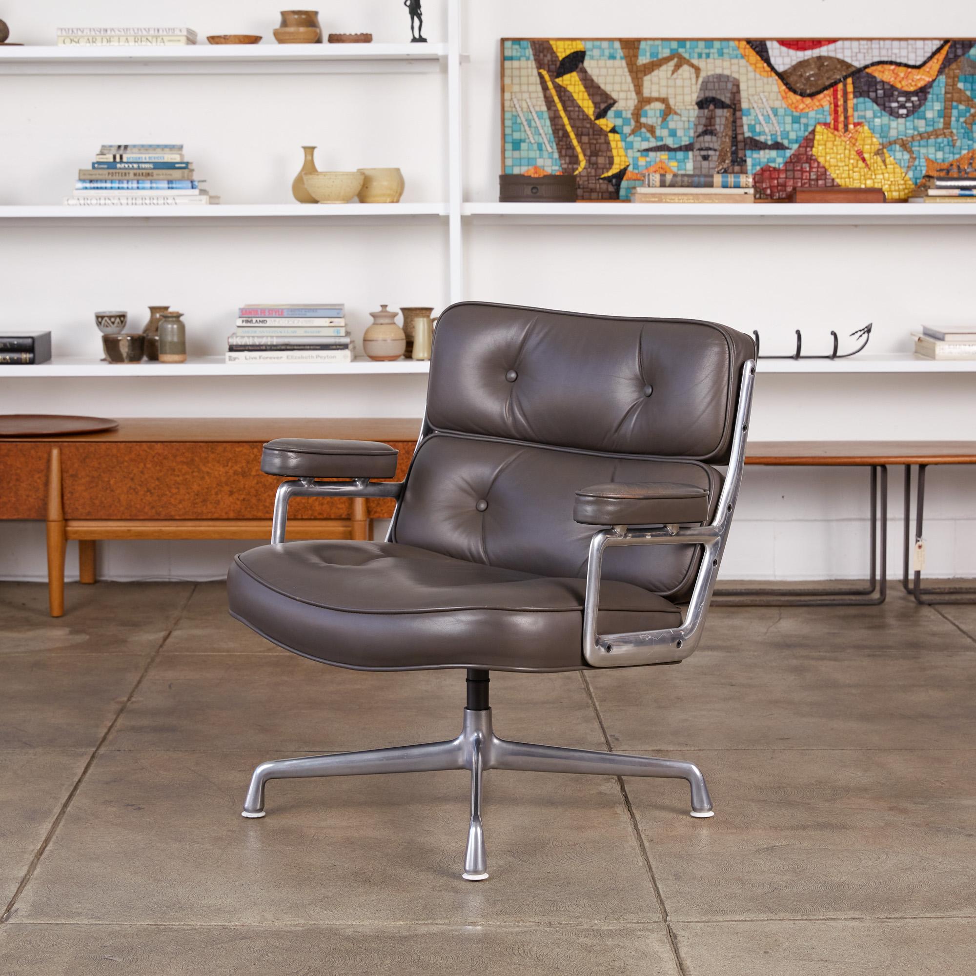 A legendary office design by Ray and Charles Eames for the three modernist lobbies of the new Time Life Building in Manhattan, the Time Life lobby chair has a polished aluminum frame and segmented, tufted cushions in leather upholstery. Leather
