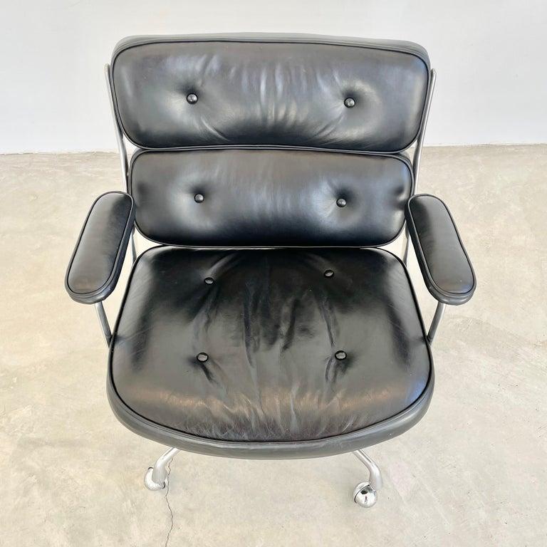 Classic Eames Time Life Lobby swivel chair in black leather with an aluminum frame. Slightly wider than the Eames office chair. All original with some wear as shown. Knob under the seat for adjusting recliner as well as the height adjustor.