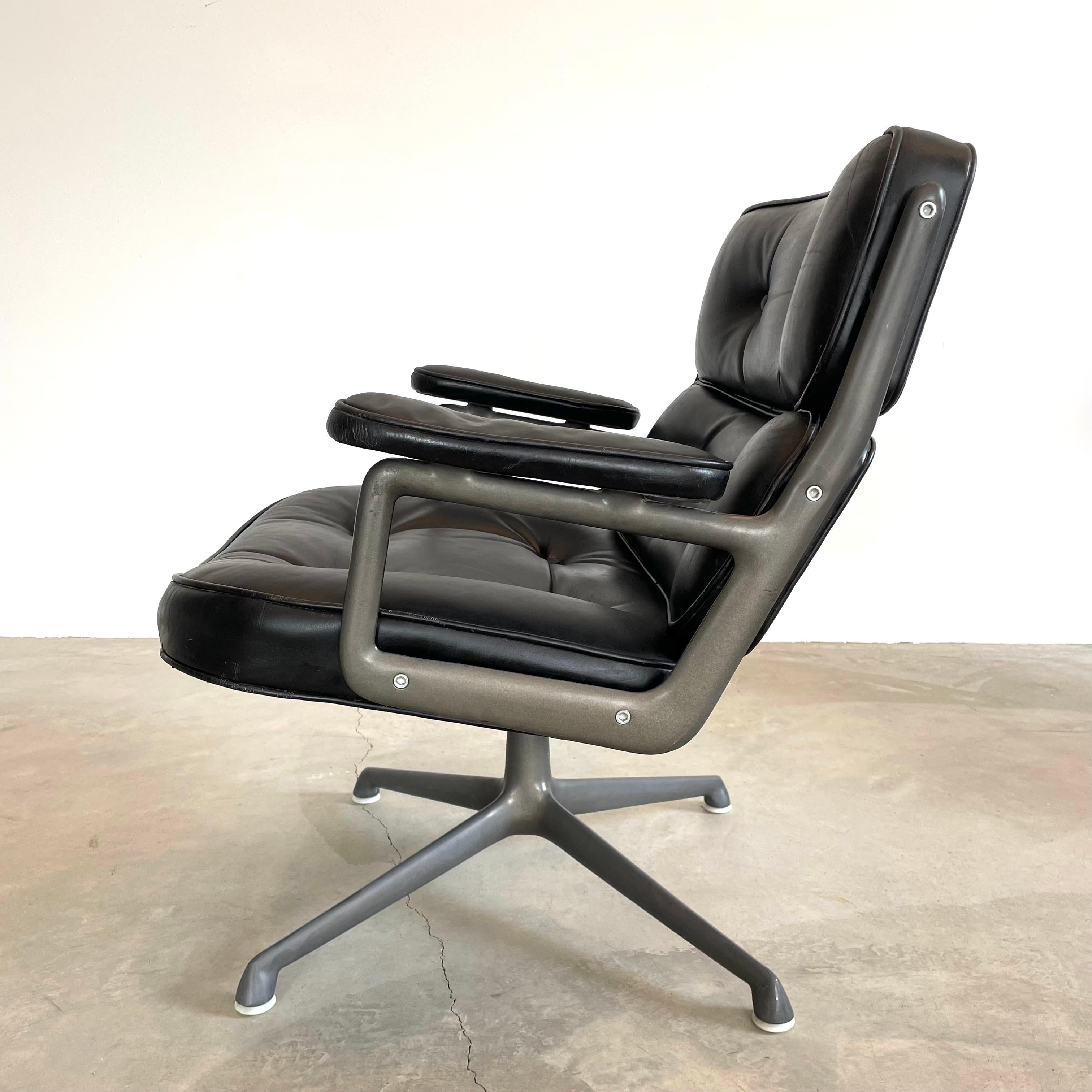 Classic Eames Time Life Lobby Chair in black leather for Herman Miller. Black leather is in good condition with wear as shown. Extremely comfortable and worn in. Chair swivels. Height is adjustable. Fantastic patina to metal and leather. The perfect