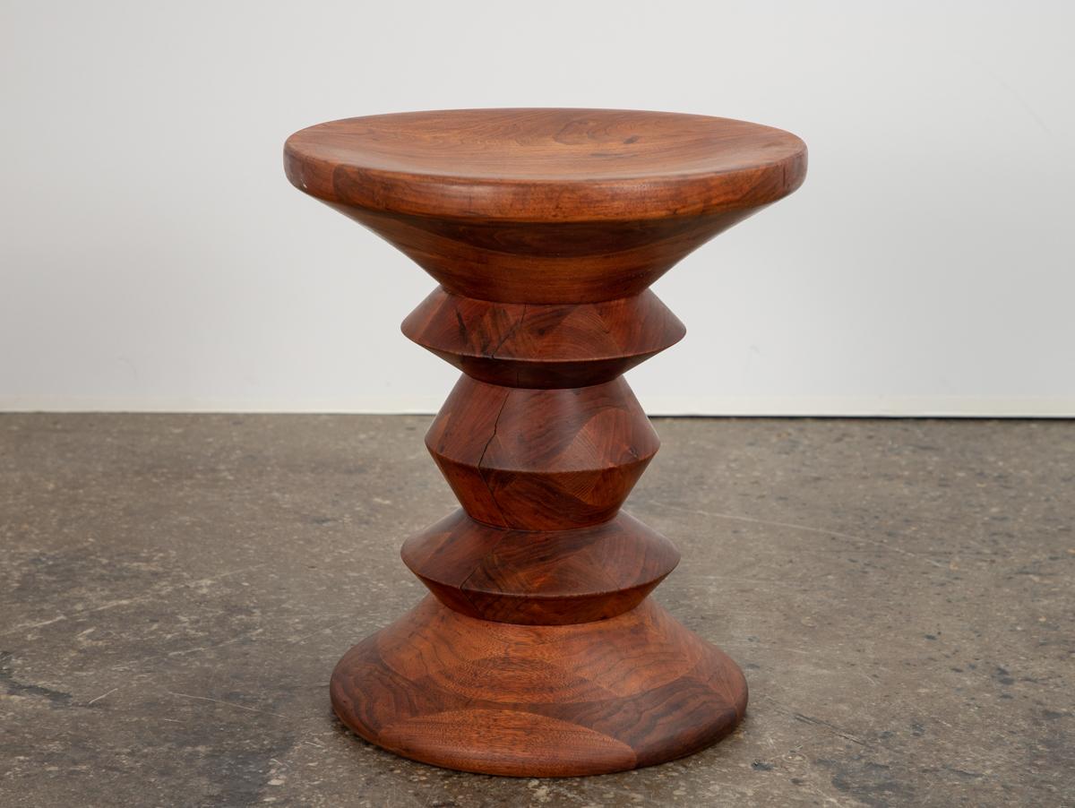 Original, first-issue Time Life Stool C, designed by Charles and Ray Eames. A striking design first commissioned for the Time Life Building and informed by Ray Eames’ sculpture practice. Our vintage example exhibits a beautiful mosaic of walnut