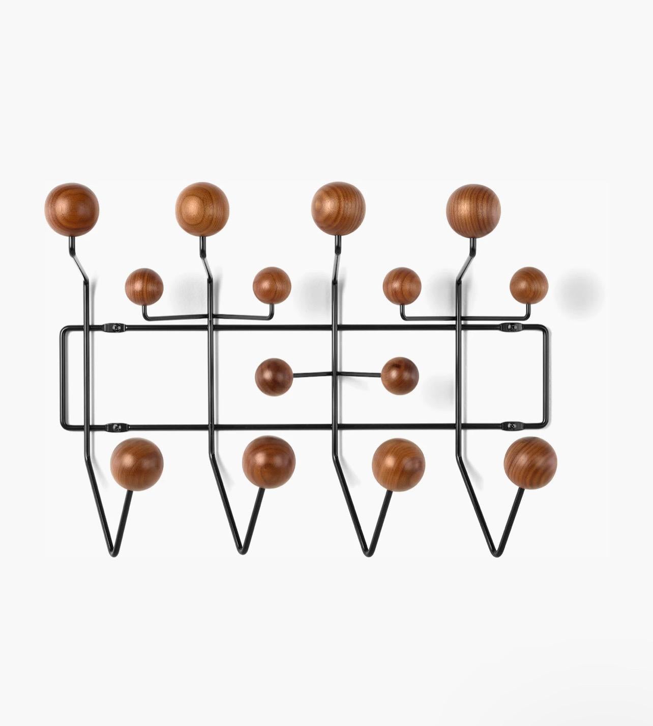 Very cool versatile original hang it all wall rack, designed by Eames for Herman Miller in solid walnut balls and metal enameled finish, very light use great condition.