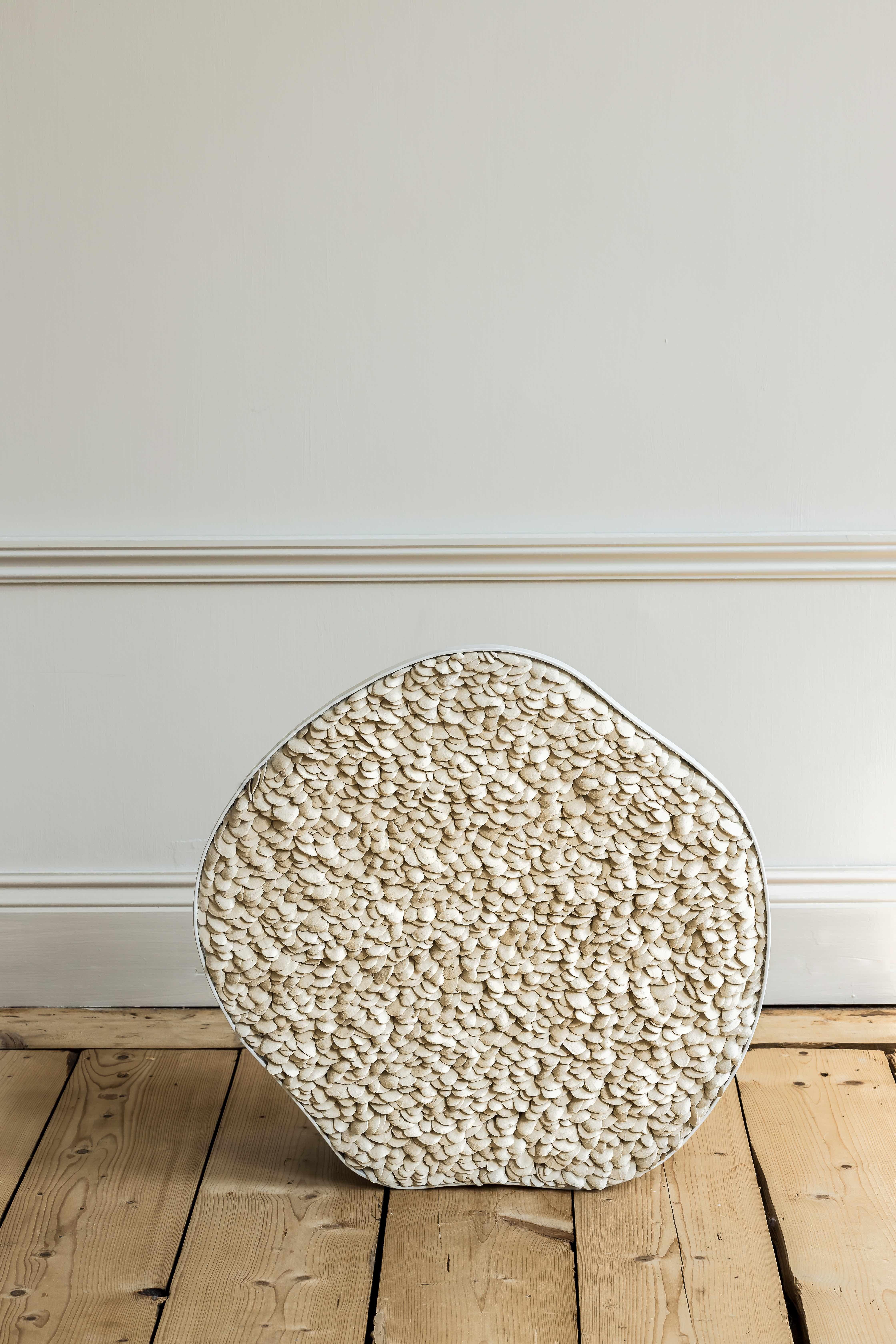 Eana rug by Hanna Heino
Dimensions: D 4 x W 55 x H 55 cm
Materials: Handbuilt, clay, porcelain, aluminium.


Hanna Heino is a contemporary clay artist from Finland known for her delicate form language that honours the beauty and subtle nuances
