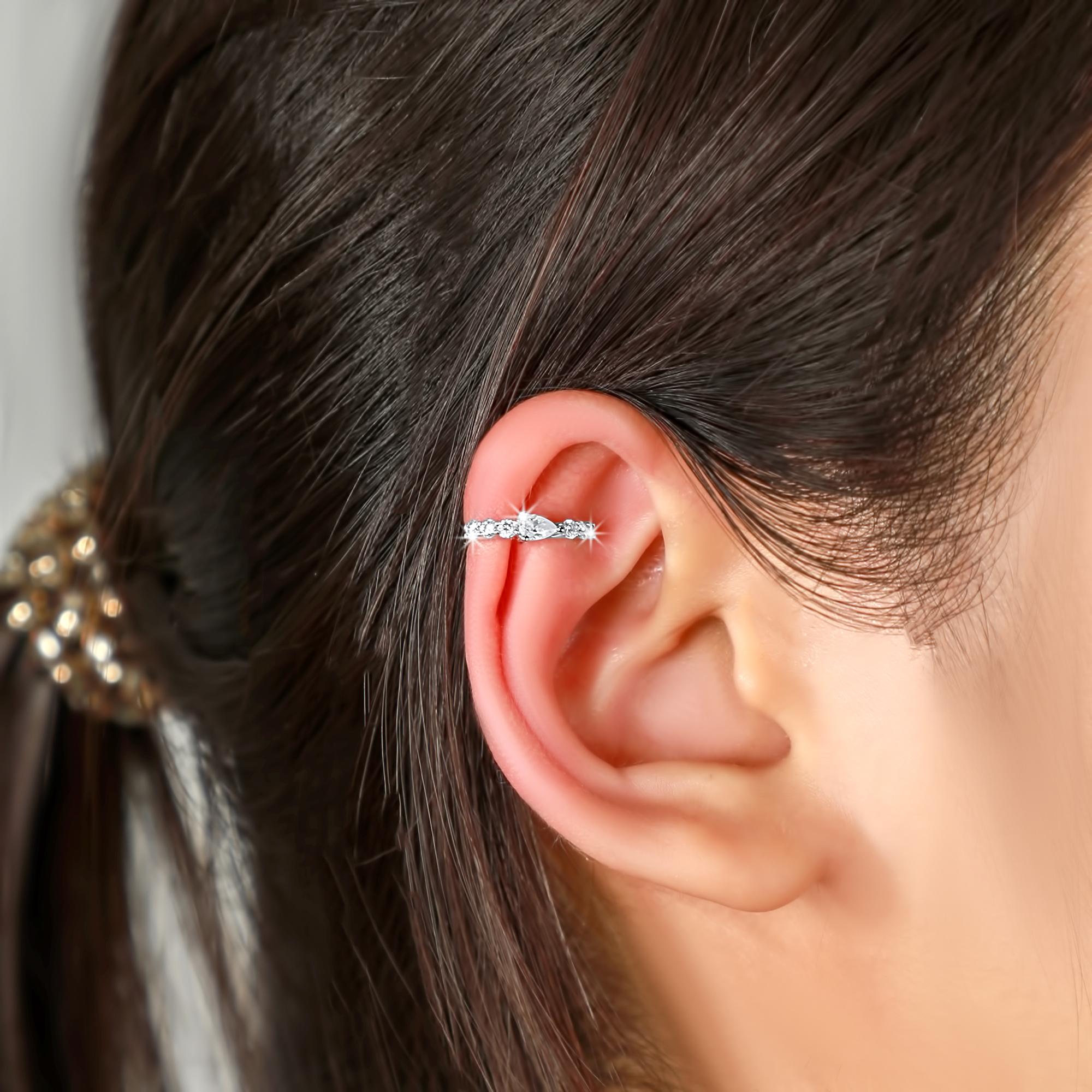 These stunning Ear Pear Shape 14K White Gold Cuff Earrings. Crafted from 14K white gold, they boast a graceful design that complements any outfit. Featuring natural diamonds with a total carat weight of 0.7, these earrings are perfect for those