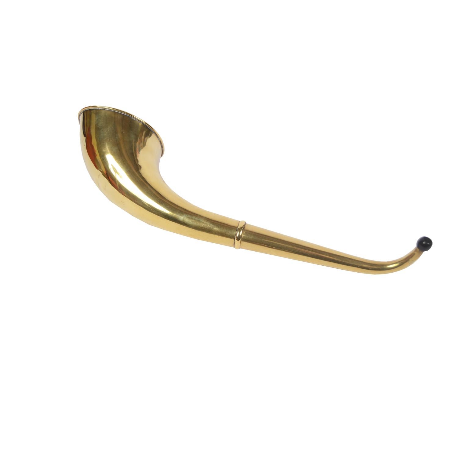 Ear trumpet of brass and Bakelite, English manufacture from the 1930s. Very good condition. Length 36 cm - 14 inches, membrane diameter 9 cm - 3.54 inches. 
The principle of its operation is based on the reflection of sound on the internal walls,