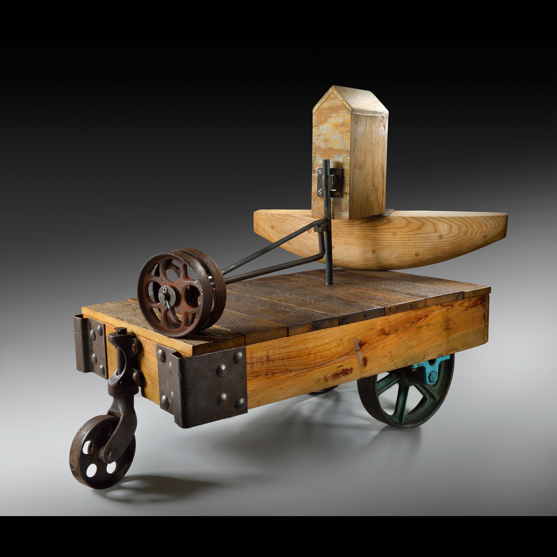 “Grist” 
2017
Fabricated wood, steel, reclaimed wheels, paint 
47 h X 31 w X 35 d (inches) 
Signed
Provenance: The collection of the artist

Born in Jamaica, West Indies, and raised in Rochester, New York, Earl James earned a Bachelor of Fine Arts