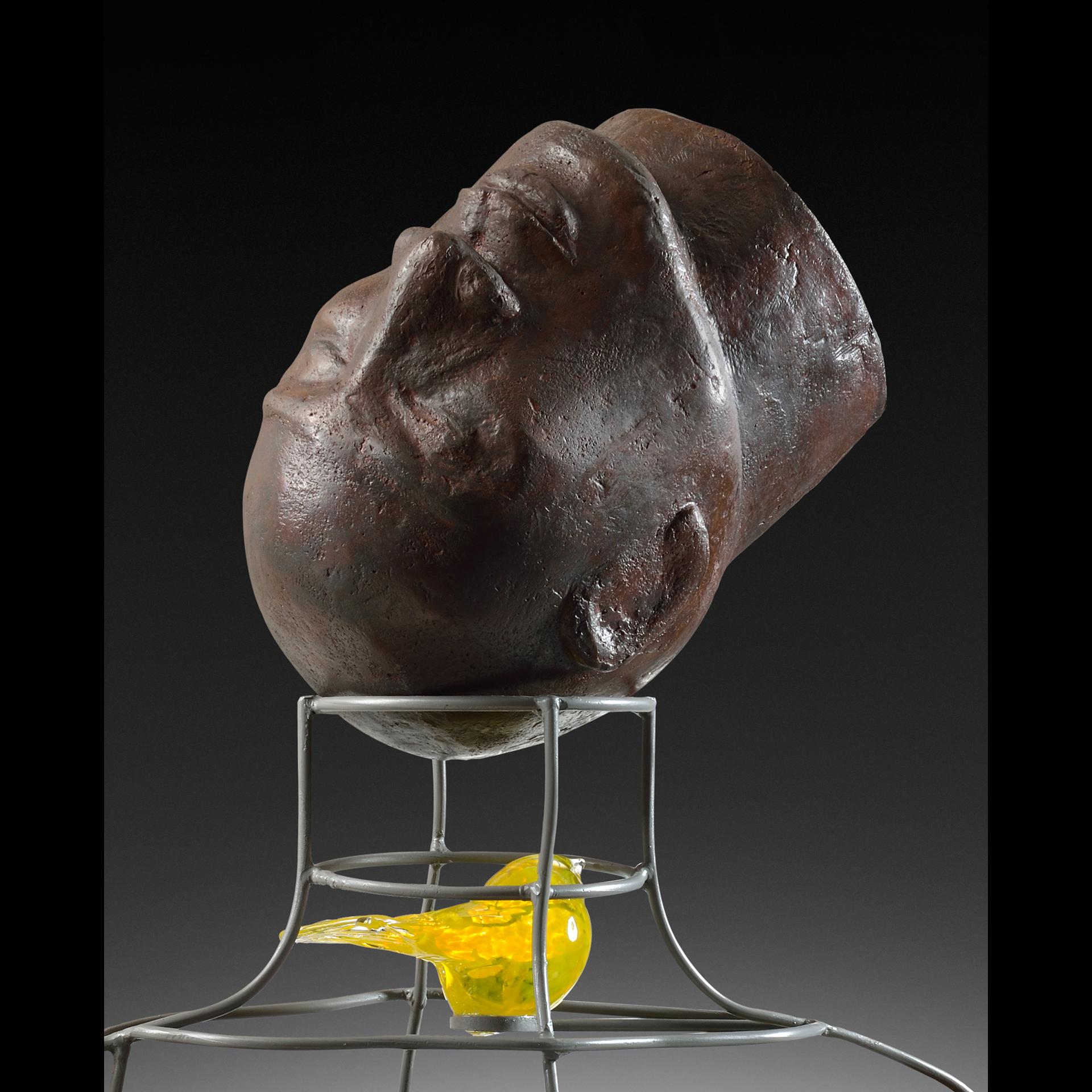 “Mindful” 
2017
A unique, surrealist sculpture made from fabricated steel, glass, cast concrete, yellow glass & paint. 
28 h x 33 w x 14 d (inches) 
Signed
Provenance: The collection of the artist

Born in Jamaica, West Indies, and raised in