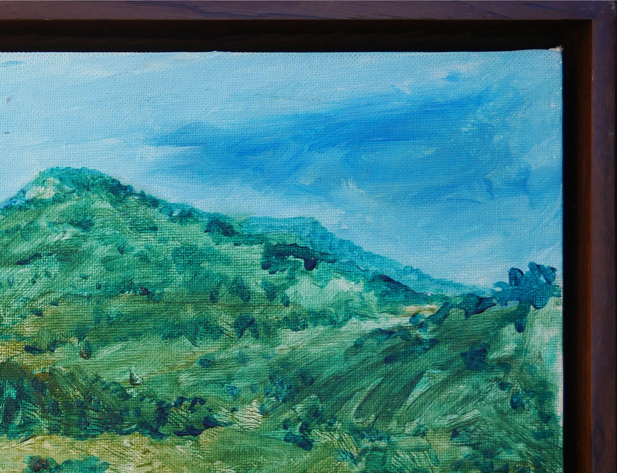 Green and blue-toned landscape painting by Houston, TX artist Earl Staley. This painting depicts a dense, green forest with a mountain in the center background. Signed and dated at bottom right corner. Currently hung in a thin brown floating frame.