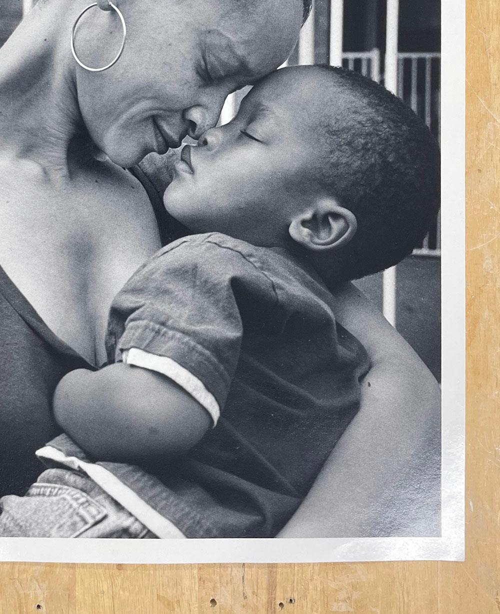 Mother and Son, Hurricane Ike by Earlie Hudnall, Jr. is a portrait of a woman embracing her child, resting her forehead against his while they both close their eyes.

Gelatin Silver Print
Paper size: 20 x 16 in.
Image size: 19 x 15 in.
Signed,