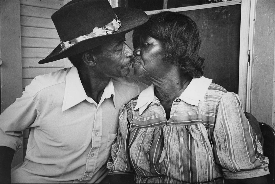 Earlie Hudnall Jr. Black and White Photograph - The Kiss, 3rd Ward, Houston, Texas