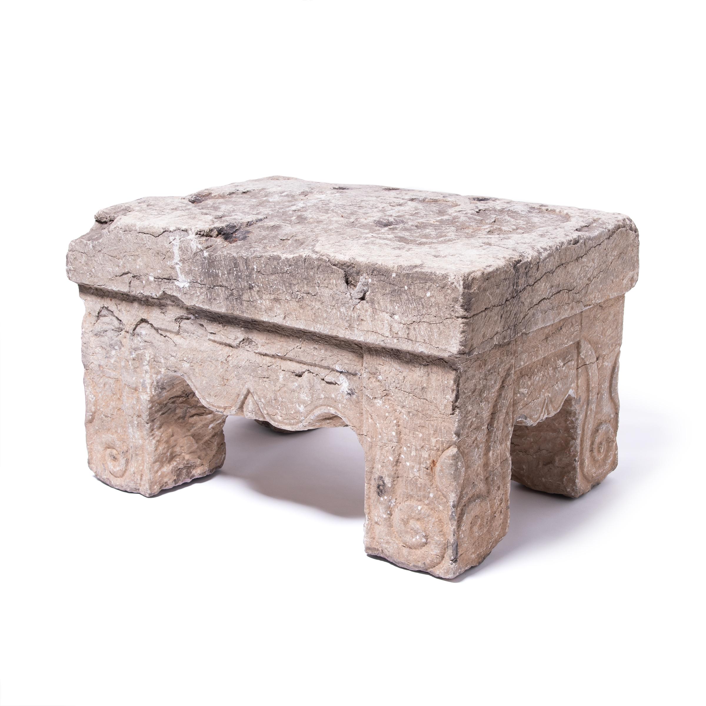 This stone table was carved over 400 years ago from a solid piece of limestone. With time, the stone develops particular undeniable characteristics: beautiful wear, patina, and oxidation, all showing its age. Stone furniture came into its own in