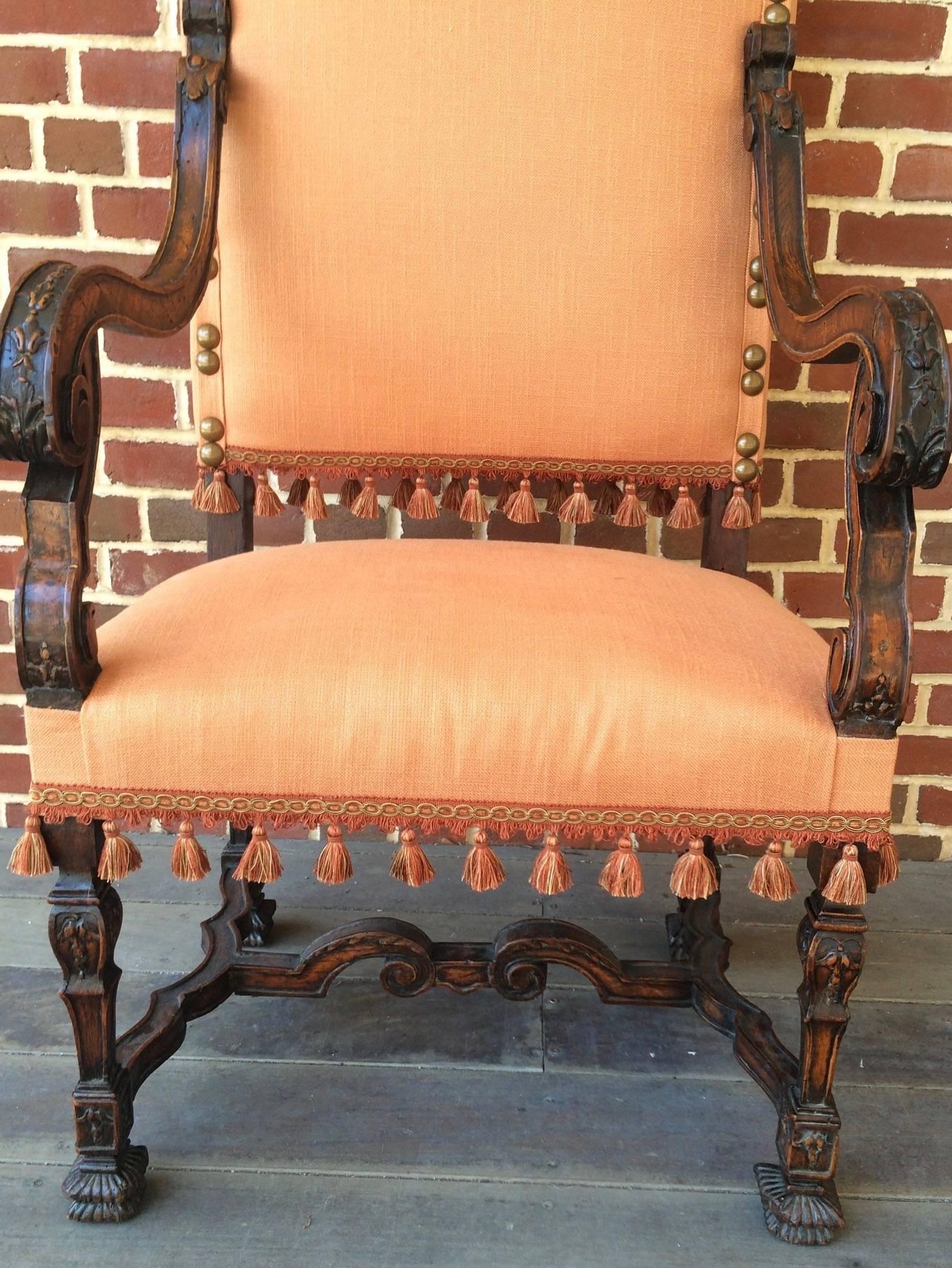 Carved Early 17th Century Walnut Armchair Upholstered in Peach Fabric and Tassels For Sale