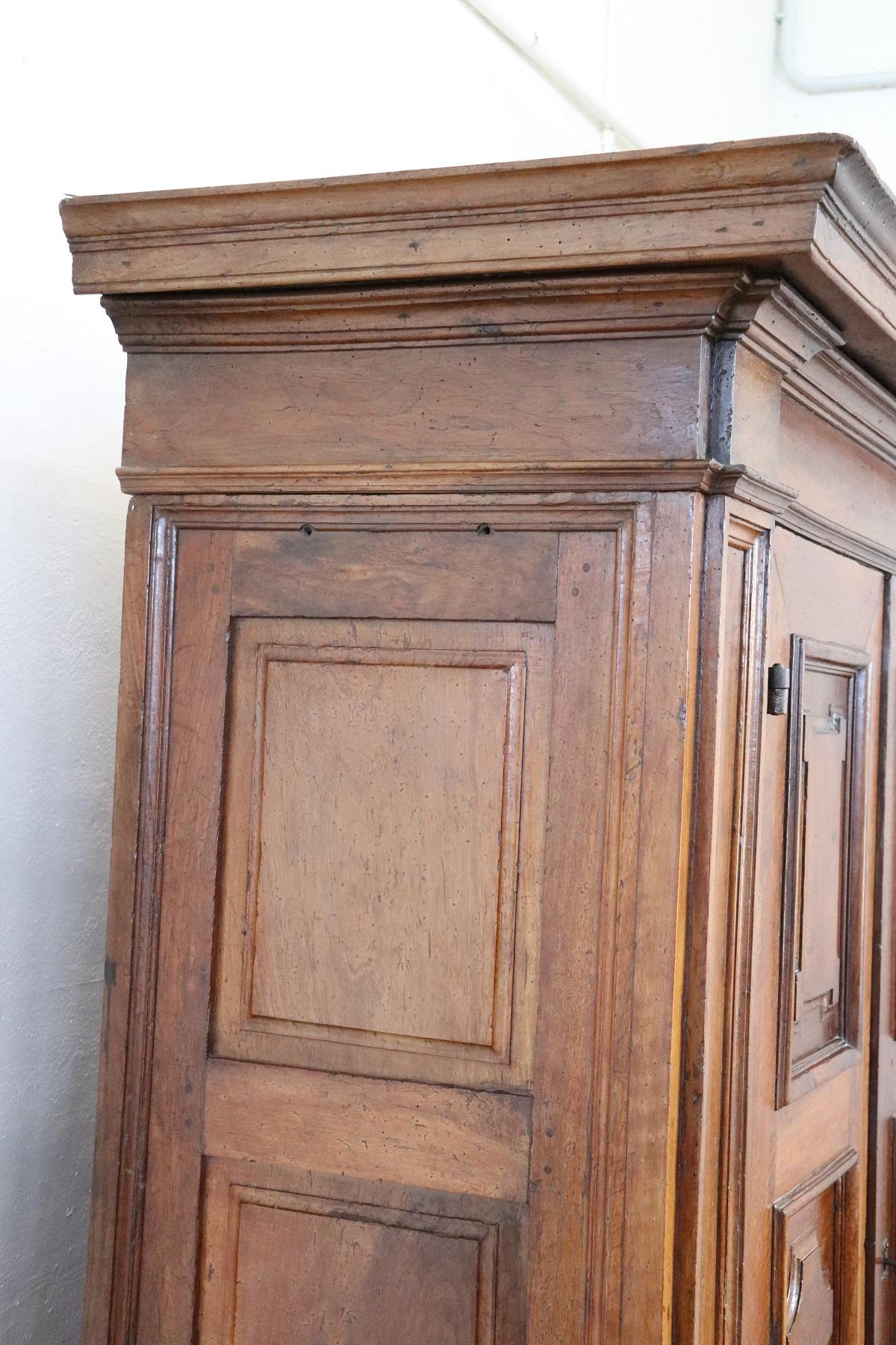 Hand-Carved Early 17th Century Louis XIV Walnut Hand Carved Antique Wardrobe or Armoire