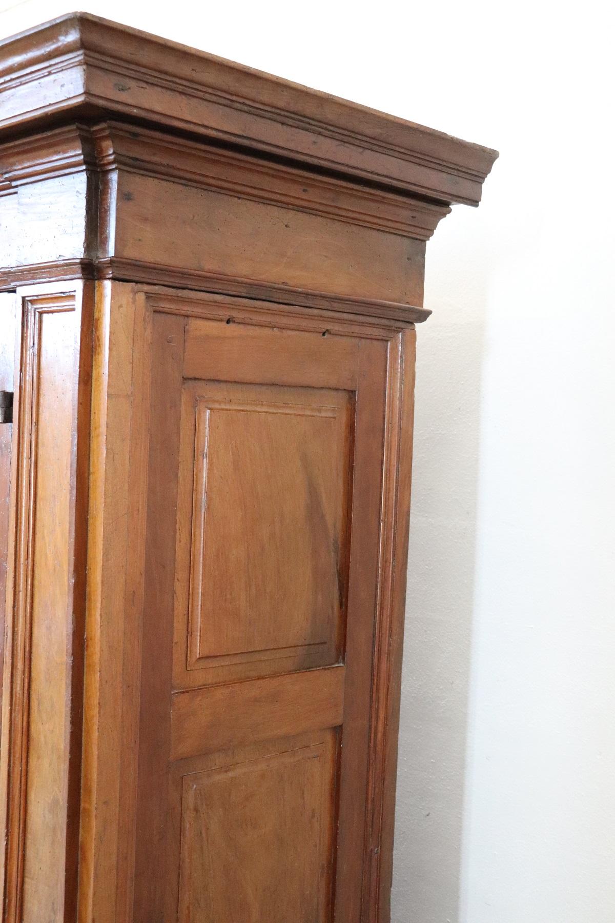 Early 17th Century Louis XIV Walnut Hand Carved Antique Wardrobe or Armoire In Good Condition In Casale Monferrato, IT