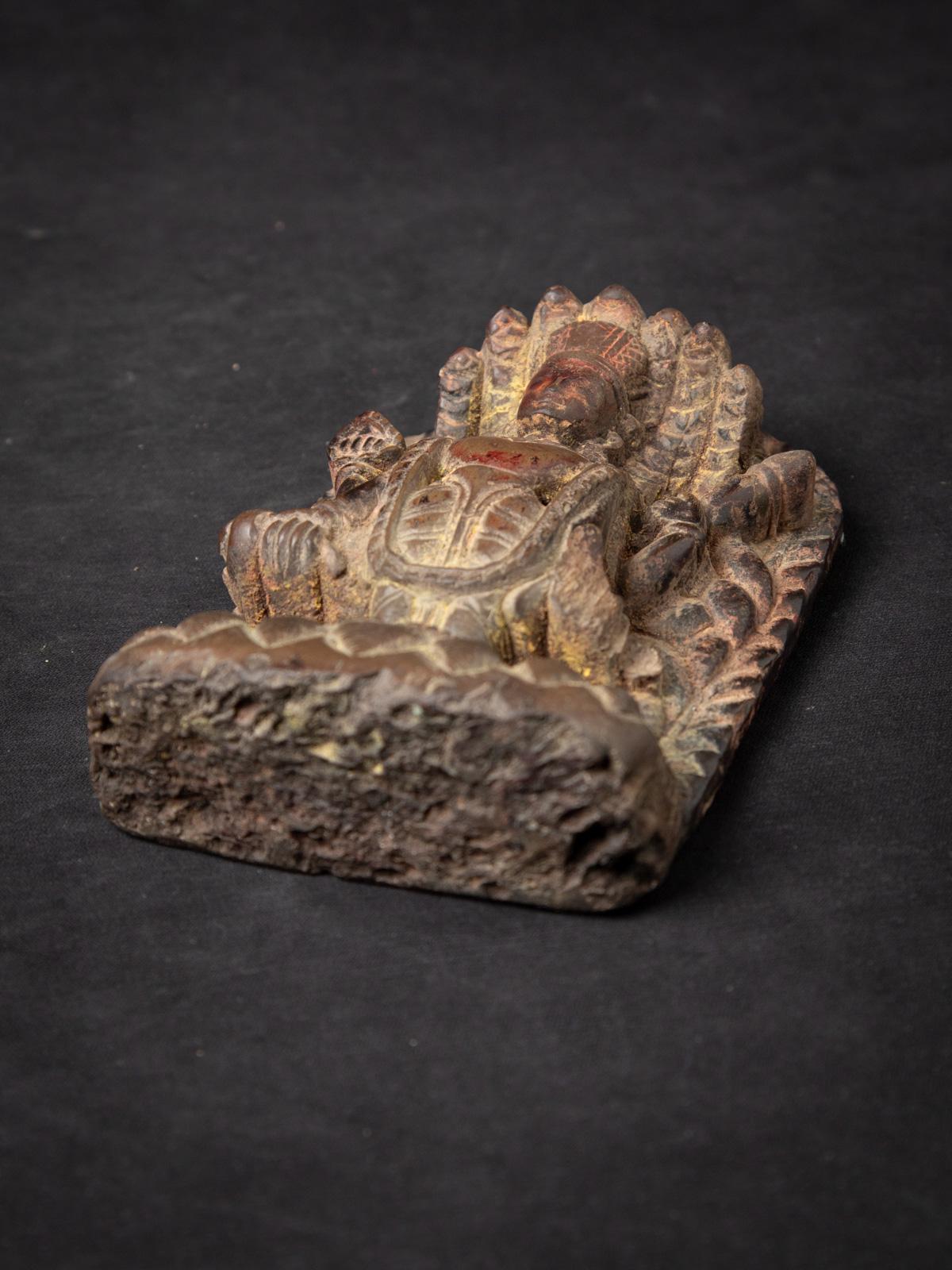 This special antique stone Vishnu statue, originating from Nepal and believed to date back to the 17th century or earlier, is a remarkable piece of sacred artistry and cultural heritage. Carved from natural stone with meticulous detail, the statue