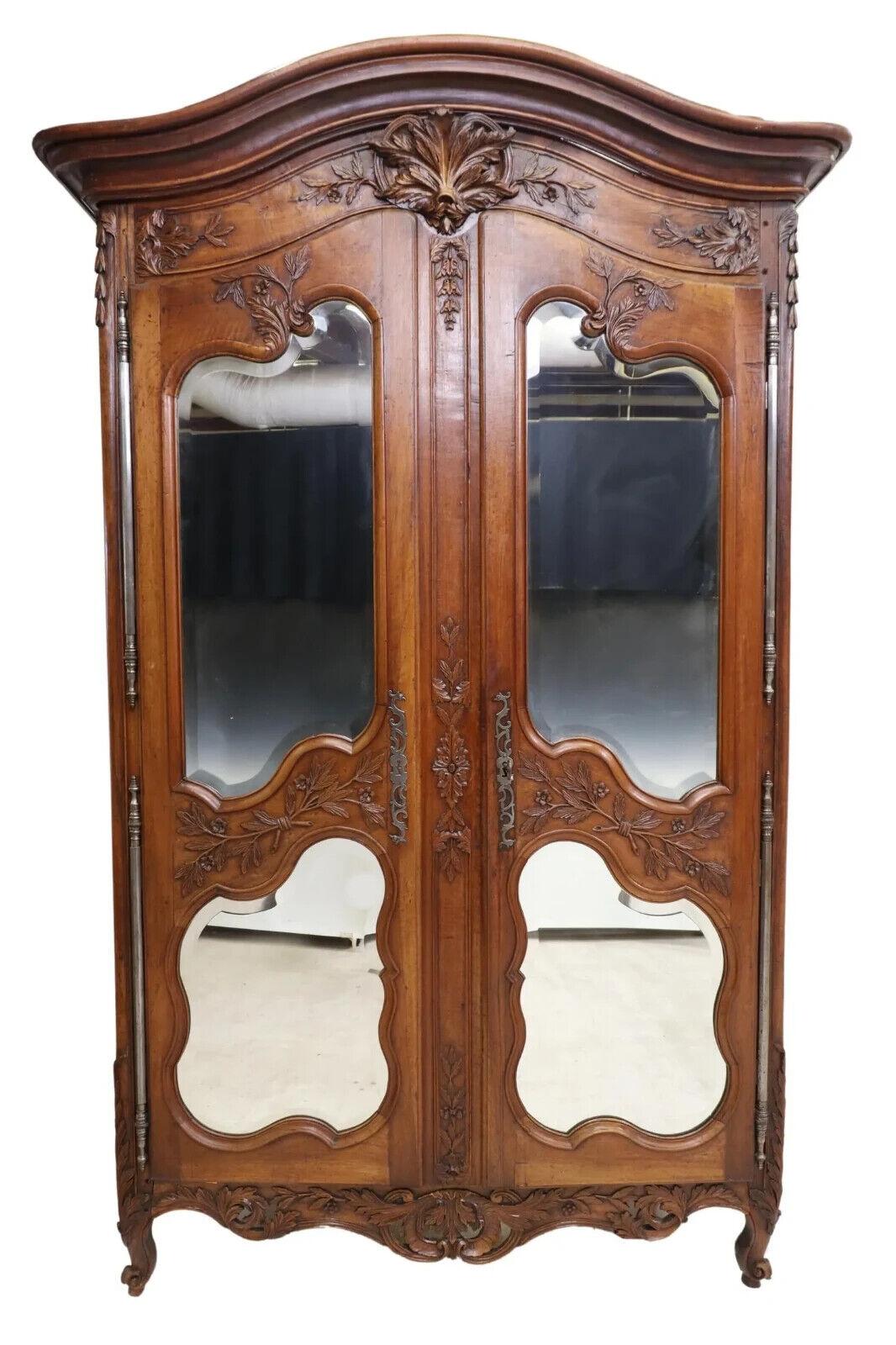 Gorgeous Antique Armoire, Large French Provincial, Walnut, Mirrored, Shelves, Early 19th Century, 1800s!!

Fine French Provincial Louis XV style walnut armoire, early 20th c., having shaped cornice, carved fanned crest, over two doors fitted with