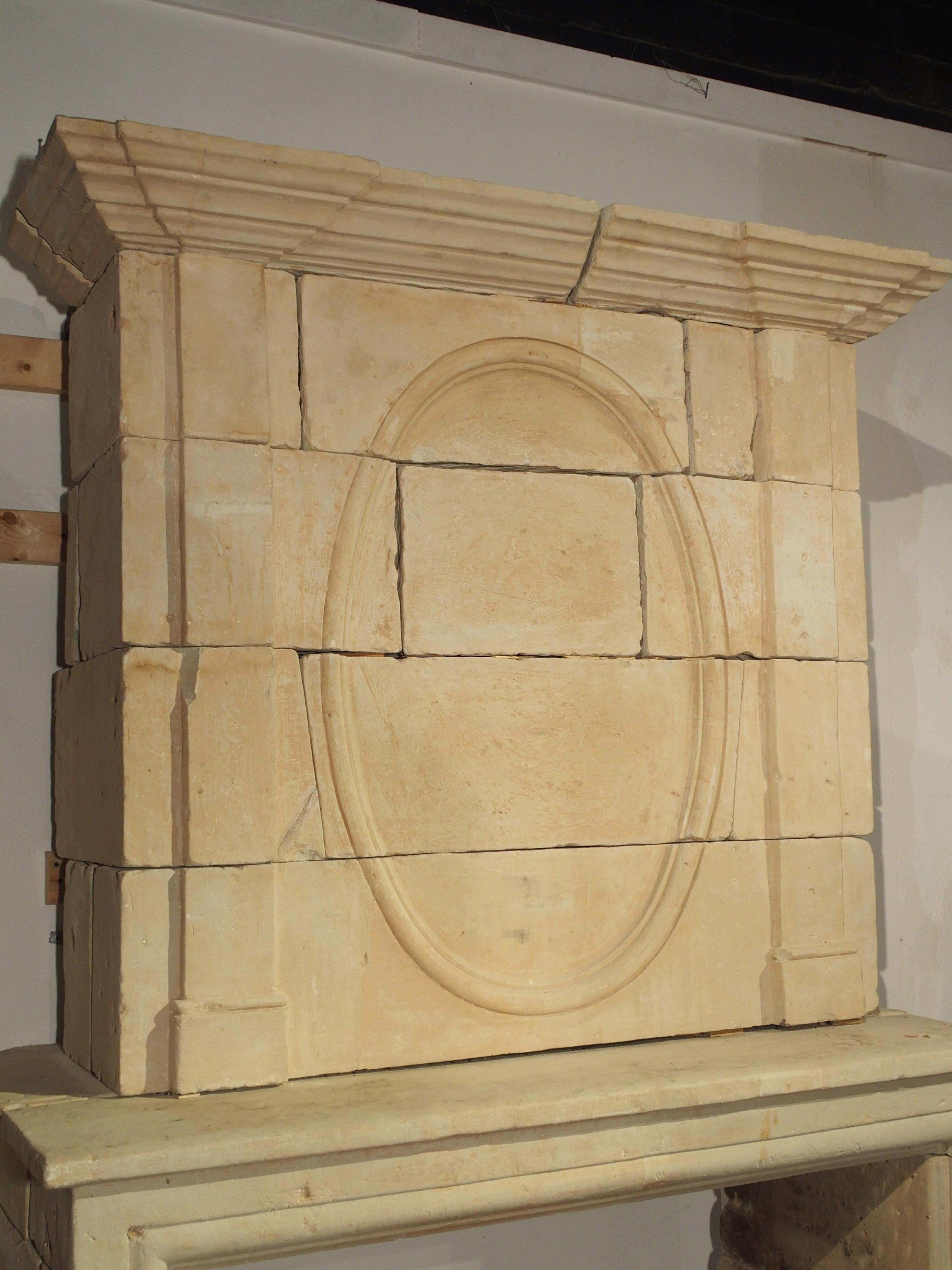 French Early 1800s Carved Limestone Trumeau Fireplace Mantel from Loire Valley, France