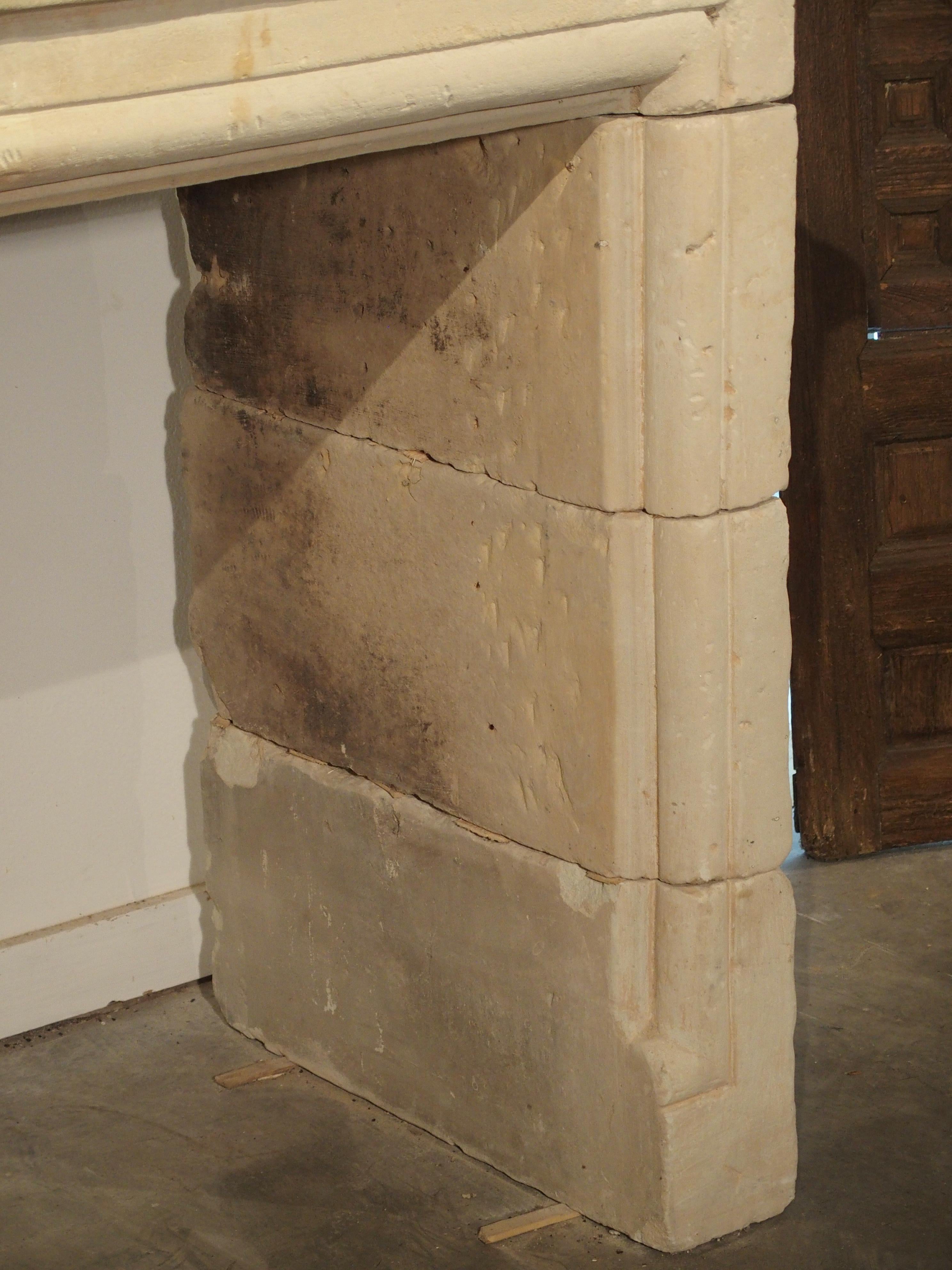 Hand-Carved Early 1800s Carved Limestone Trumeau Fireplace Mantel from Loire Valley, France