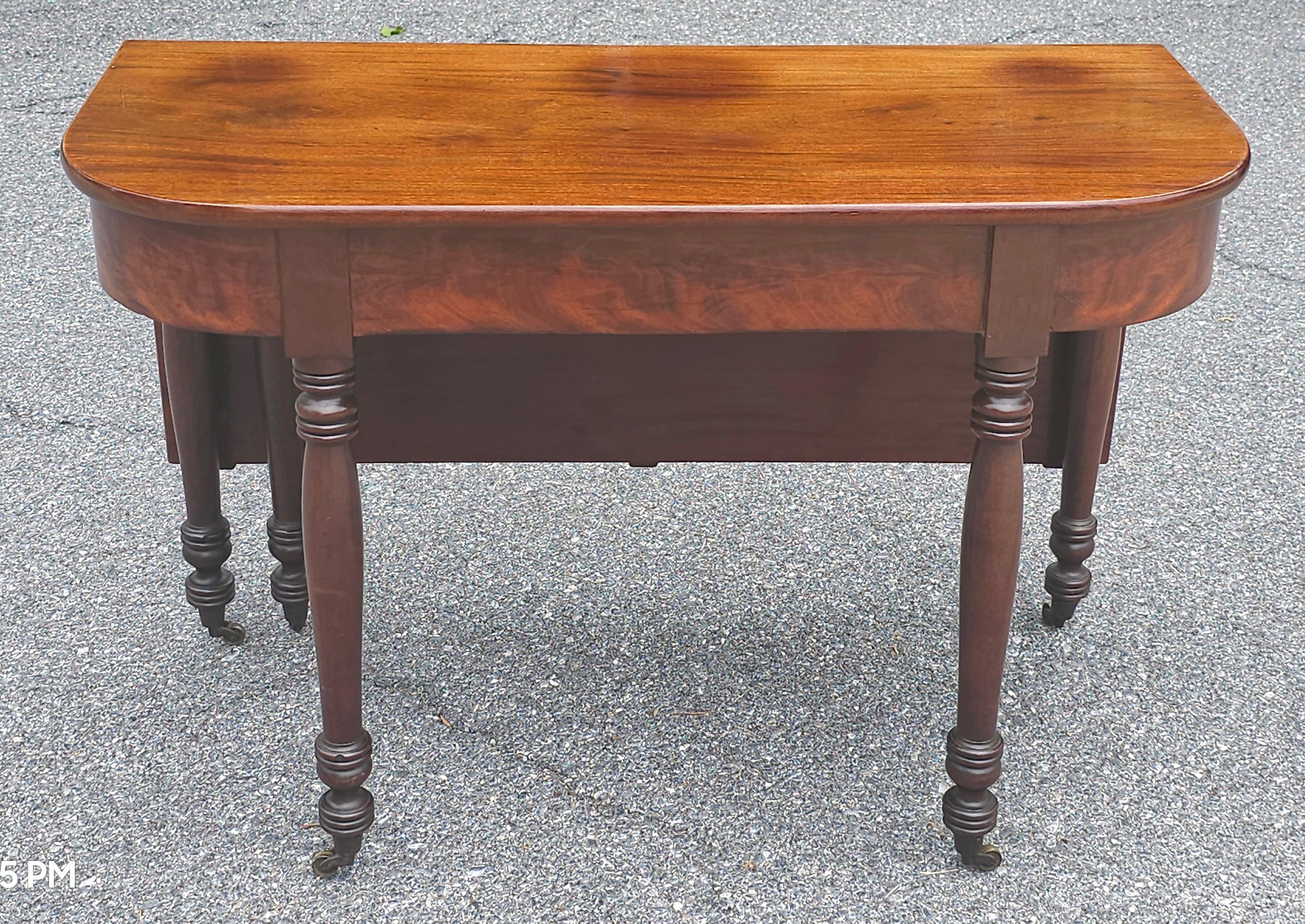 A large Early 1800s American Federal Mahogany Single Drop Leaf Table. Measures 45