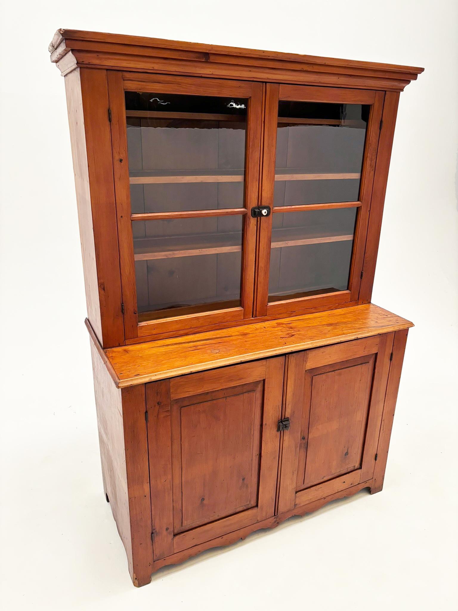 Primitive Early 1800’s Pennsylvania Dutch Pine Country Cupboard with Wavy Glass Doors For Sale