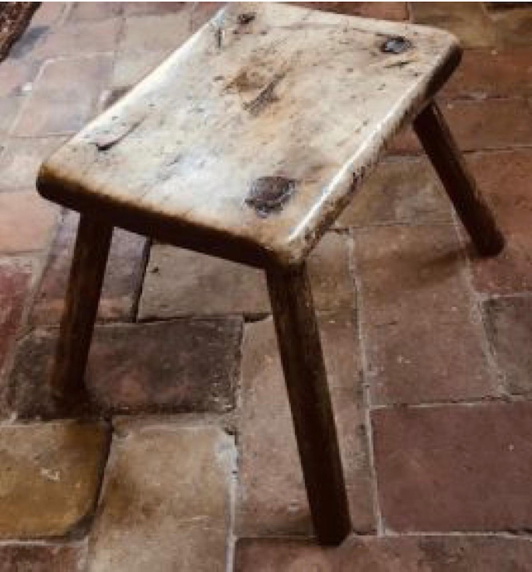 Early 18th century ash stool, beautifully crafted with dowel joinery. The ash wood is so wonderfully worn that the entire piece has the smoothest of finishes. 