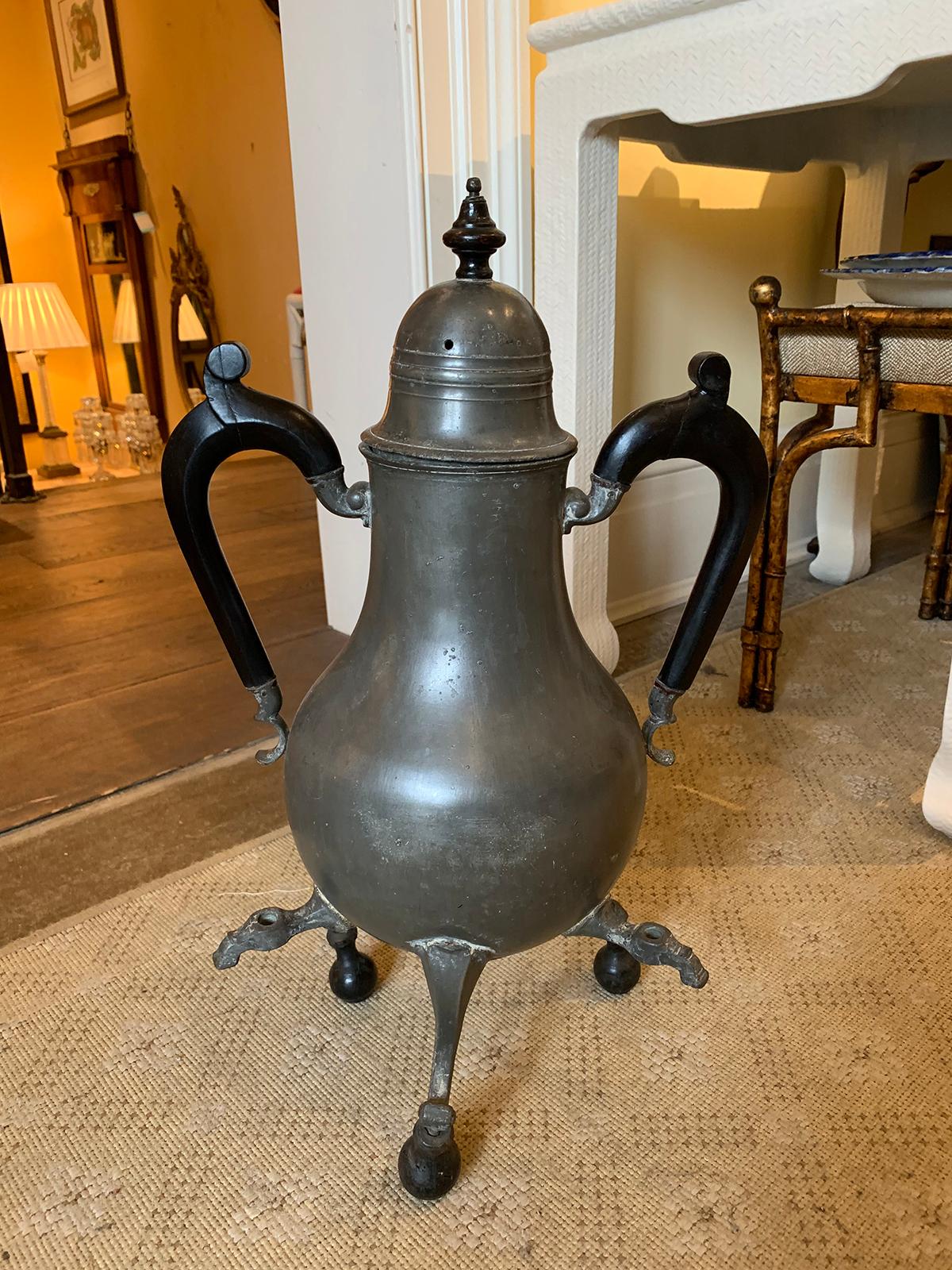 Early 18th-19th century pewter lidded hot water urn, three spouts, wood handles
Measures: Overall: 12