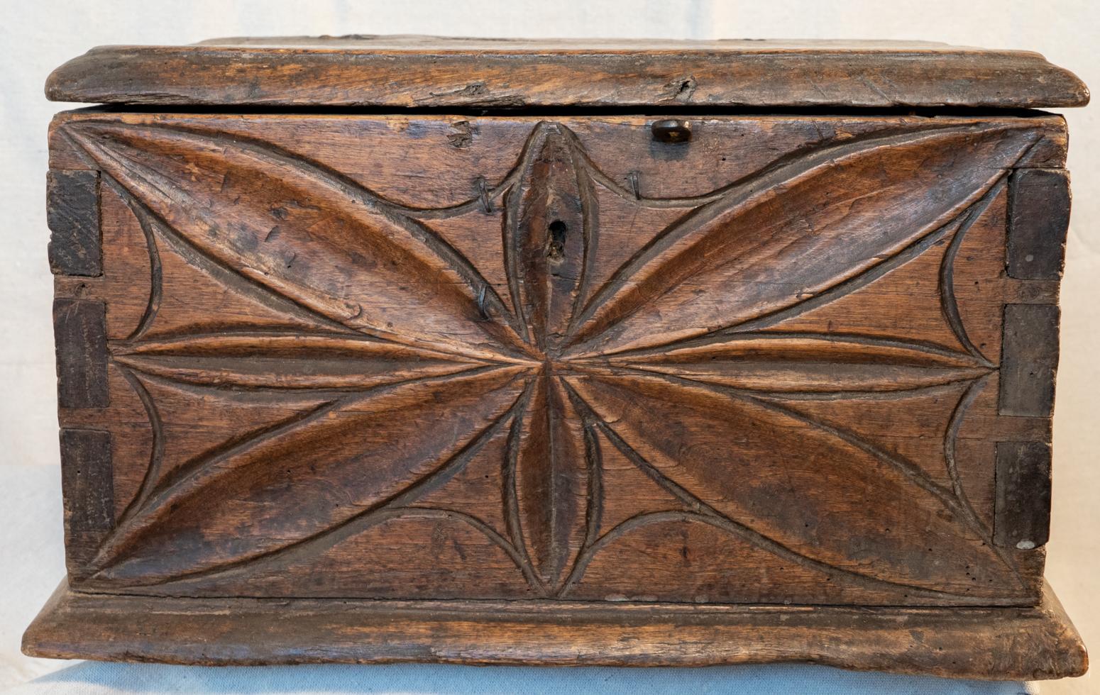 Early 18th century Italian carved and dovetailed walnut alms box, circa 1725
Large dovetails and old handwrought nails give this small scale box a heavy, rugged and strong build. A crude coin slot cut into the top complete with an old iron push