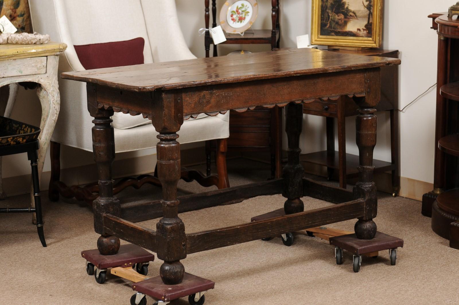 Early 18th Century Oak Console Table with Carved Apron, Turned Legs, & Box Stretcher. Finished on All Sides.