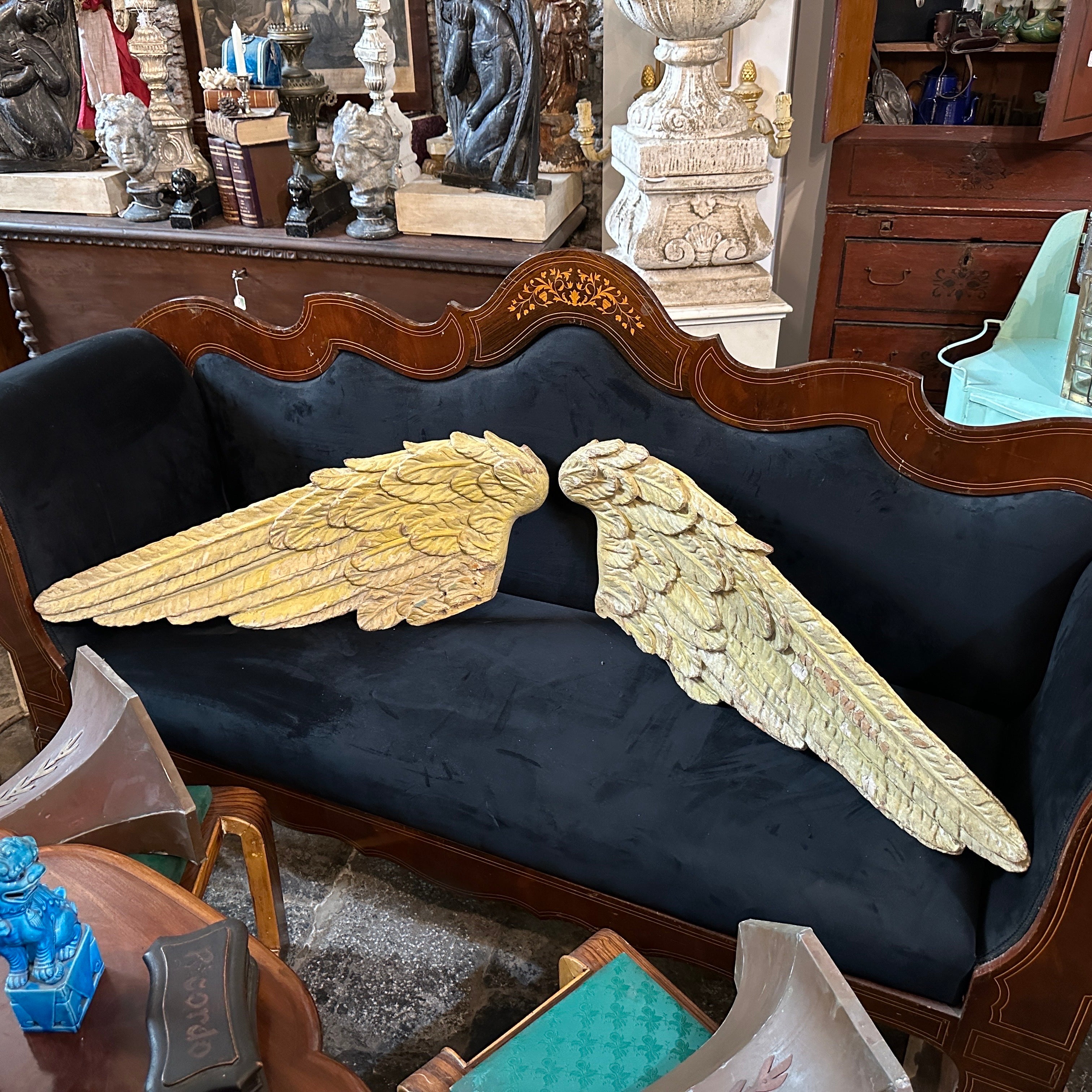 These two hand-carved wood Italian angel wings are remarkable artifacts, exemplifying the grandeur and ornate beauty of the Baroque period. They are in good original condition with signs of use and age. This pair of angel wings is a masterpiece of
