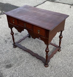 Early 18th Century British Three-Drawer Oak and Walnut Lowboy