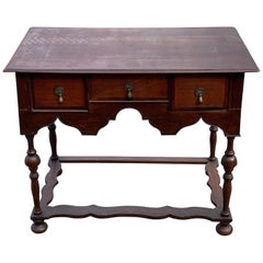 Early 18th Century British Three-Drawer Oak and Walnut Lowboy