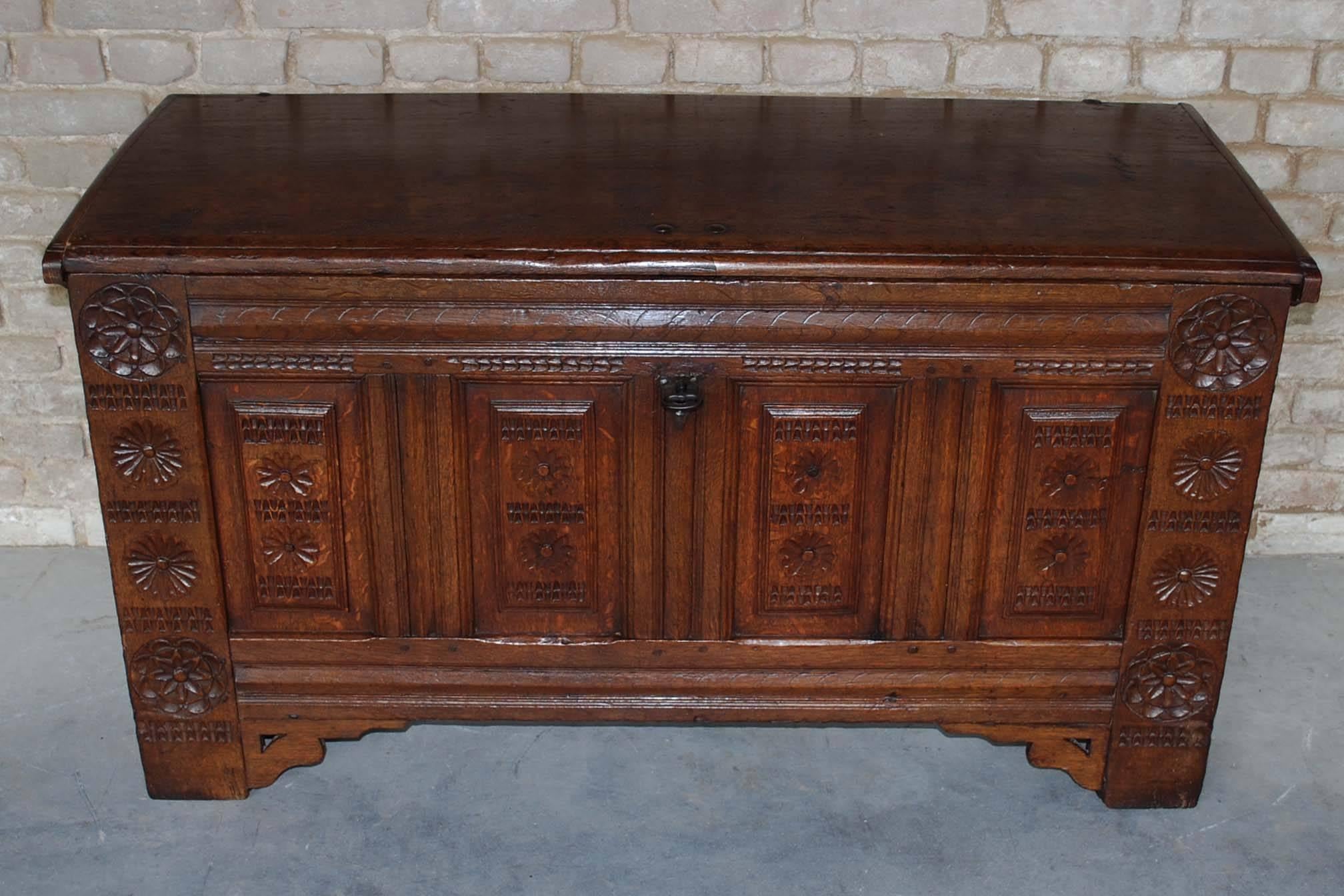 This solid oak carved chest was made in circa 1720 and originated in the Netherlands.
It is made in Rebaissance style and it has the typical elevated panels in the front section.
The front has beautiful geometric carvings. It has the original lock