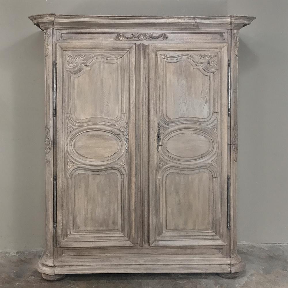 Completely hand-made from old growth French oak from the storied Loire Valley, this amazing Antique Country French Armoire has stood the test of time!  Hand-crafted by talented artisans during the early years of the reign of Louis XV, it boasts a