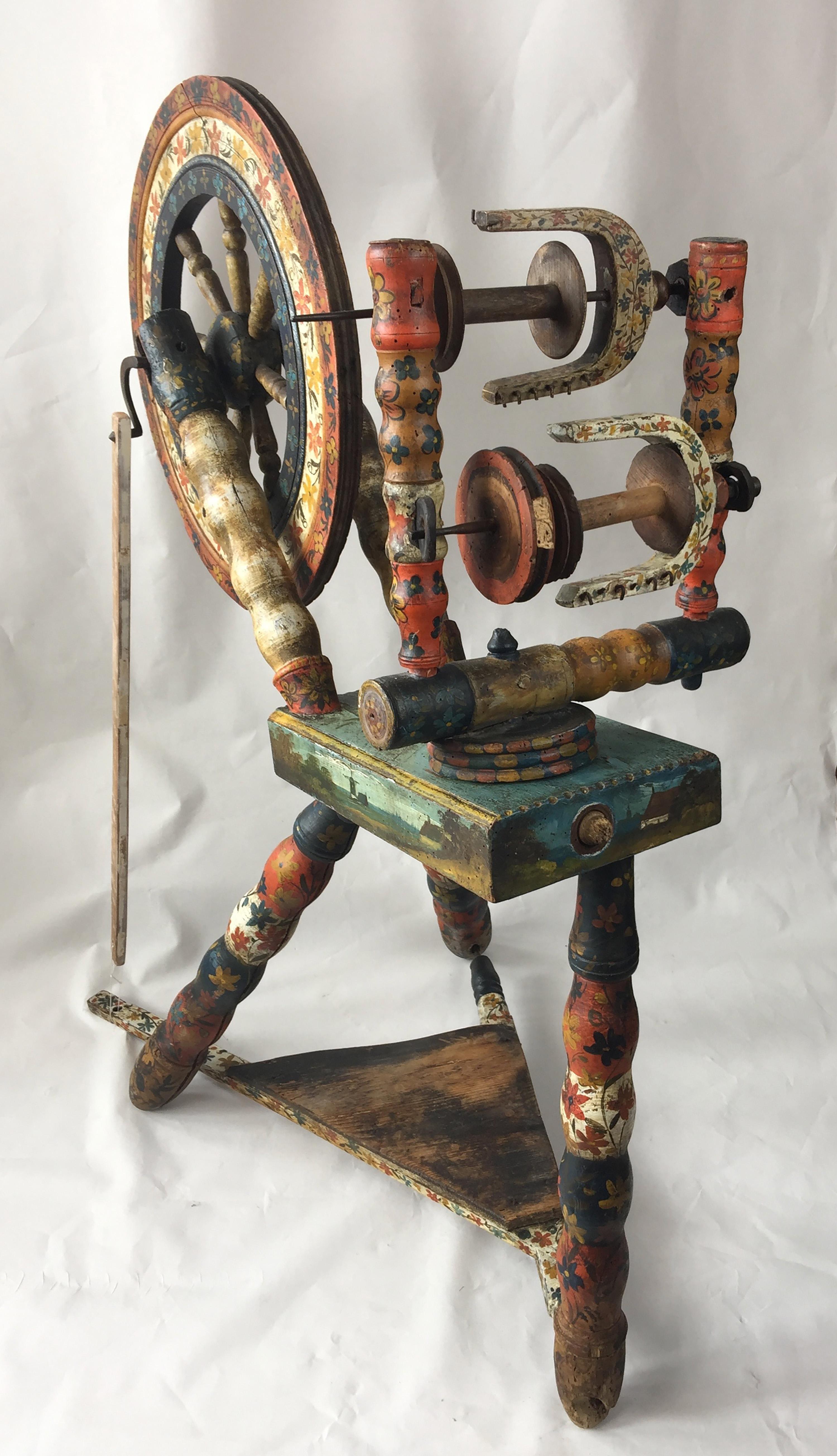 Thought to be 17th or early 18th century Dutch painted and decorated spinning wheel, showing a lot of wear from use. Decorated with scenes of Dutch multi masted sailing ships bearing the Dutch flag on one side and Windmills on the reverse. The Dutch