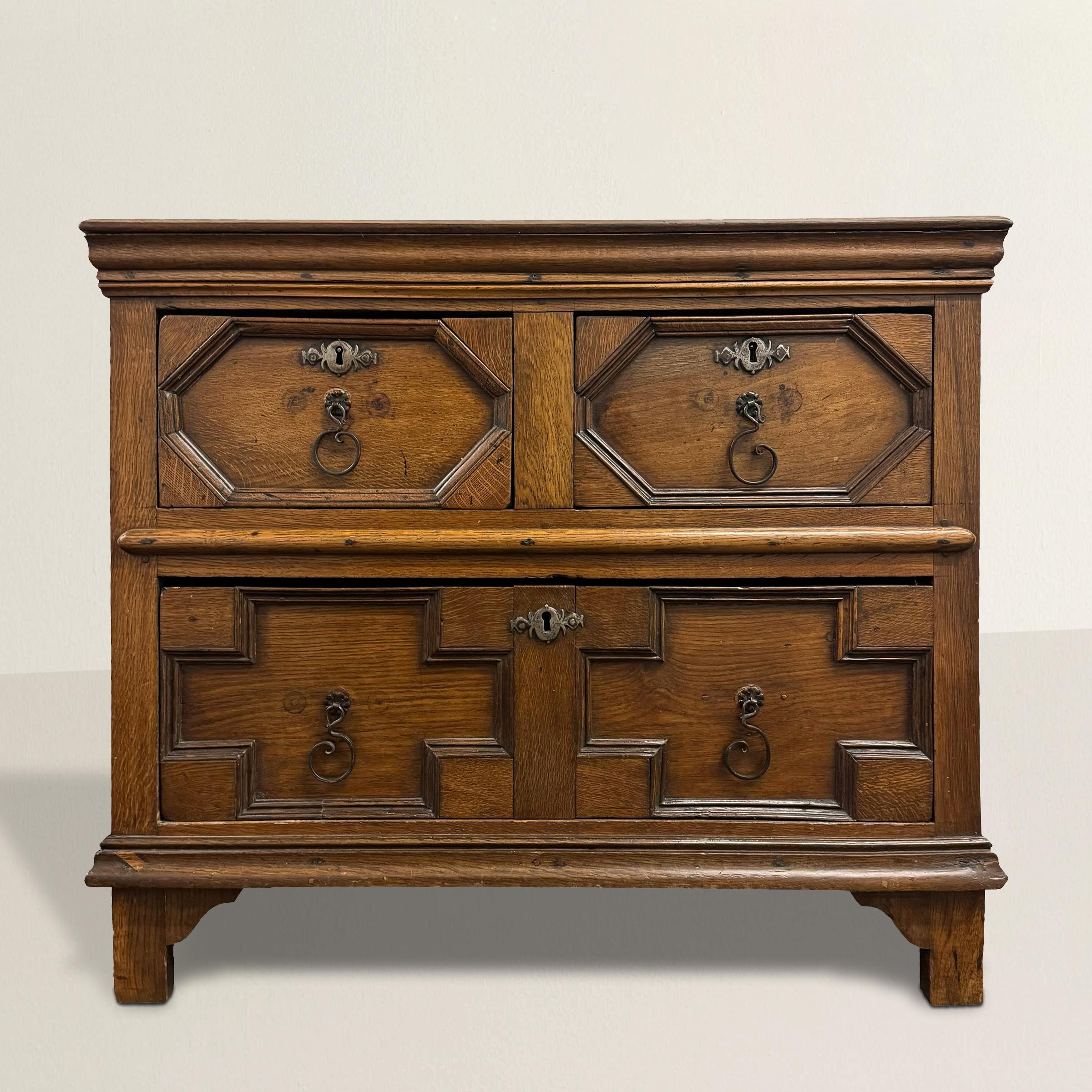This early 18th-century English William and Mary oak chest of drawers epitomizes the timeless charm and versatility of its era. Featuring characteristic William and Mary styled geometric drawer fronts, this chest exudes both elegance and