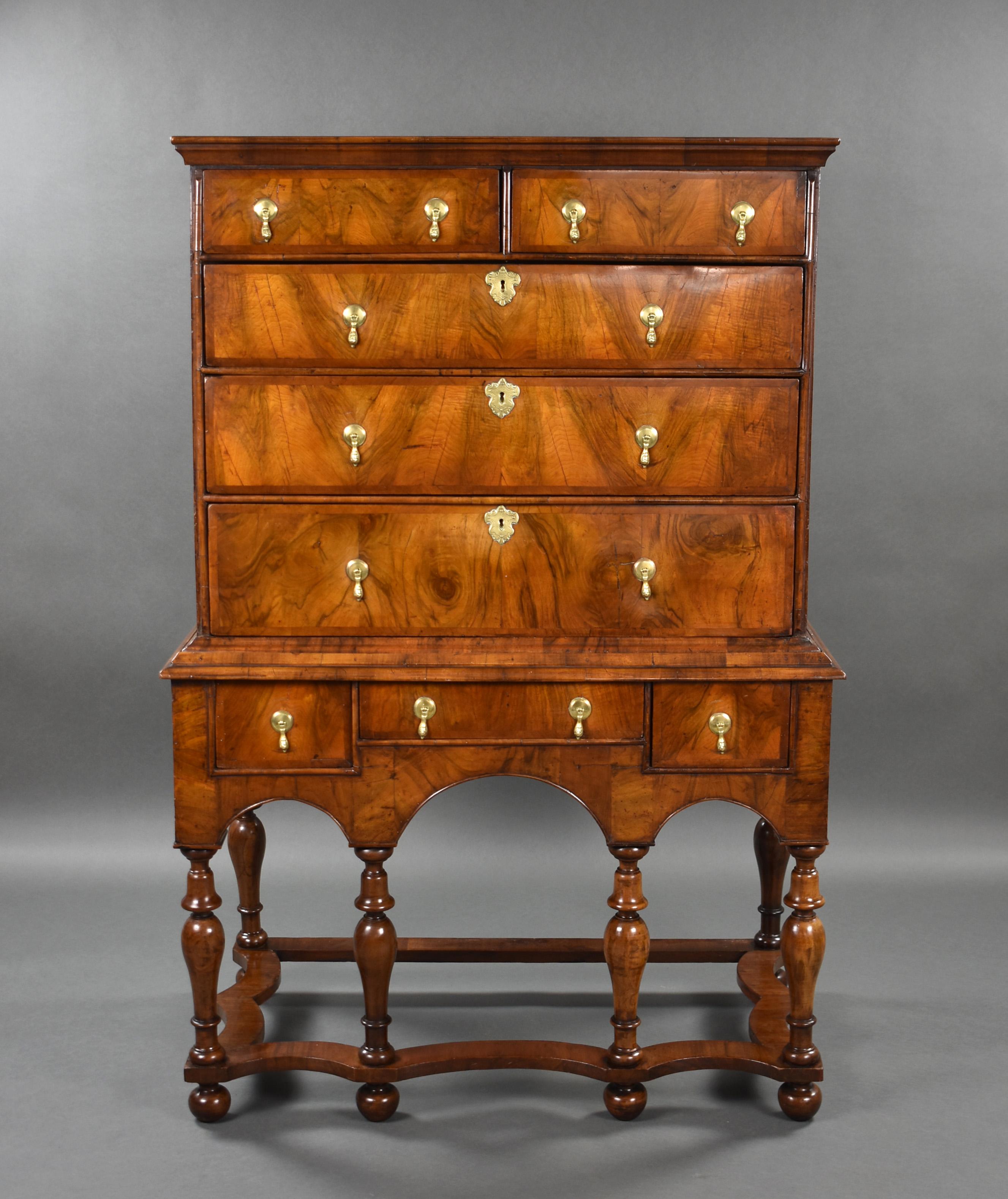 For sale is a good quality early 18th century William & Mary chest on Stand. The upper section having two short over three long drawers, the base having three short drawers above turned supports and bun feet, united by a wavy stretcher. This piece