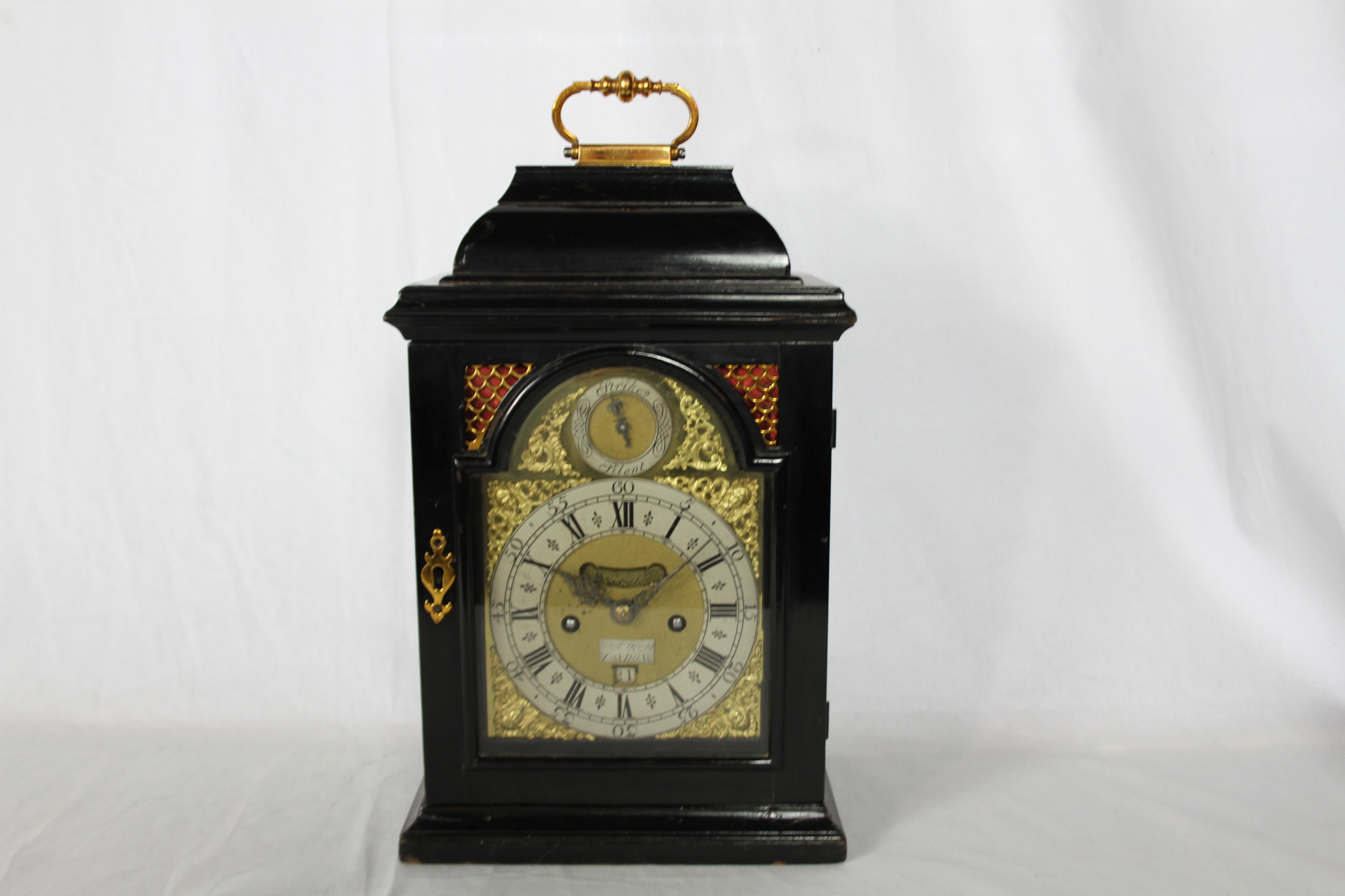 Francis Gregg, London.
A fine table clock. The break arch brass dial with silvered chapter ring, matted centre, calendar aperture and false pendulum aperture with silvered cartouche signed Francis Gregg London. Rise and fall regulation to the arch.