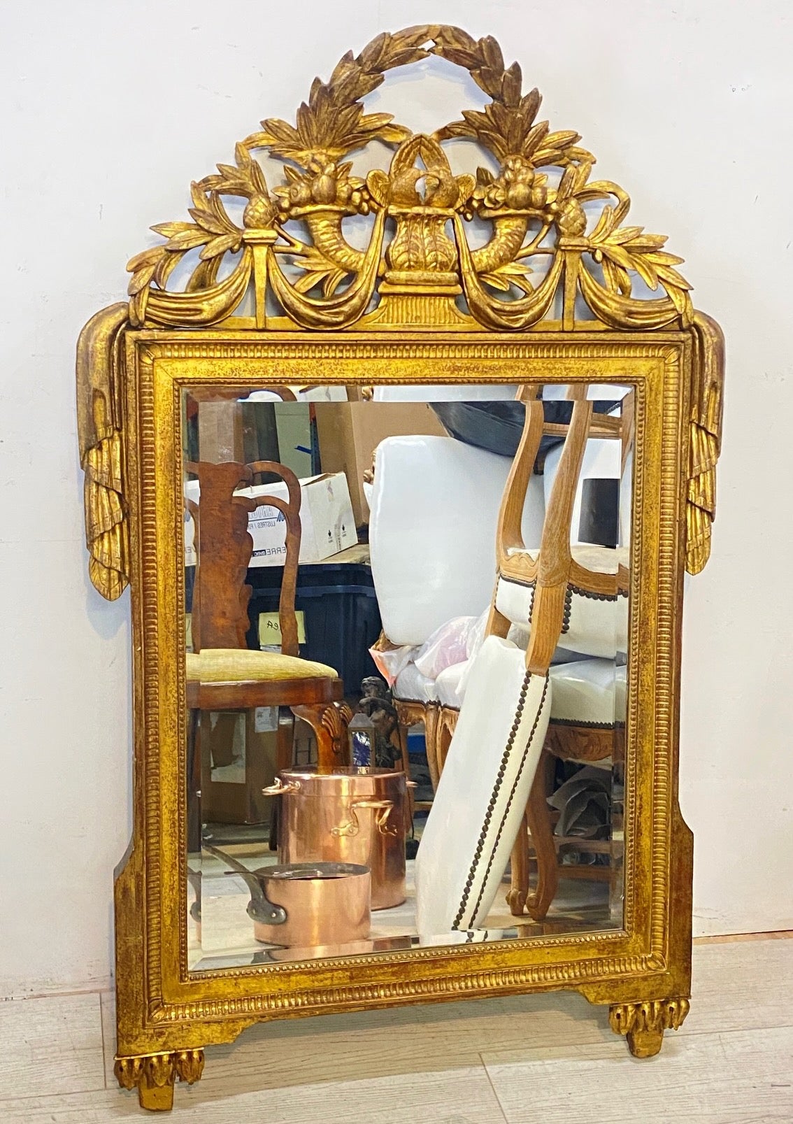 A fine early 18th century French carved and gilt wood framed mirror. The top paired with birds, horns of plenty, and draped foliate sprays.
A superb example of this period style mirror, and having its original back.
The mirror looks to have been
