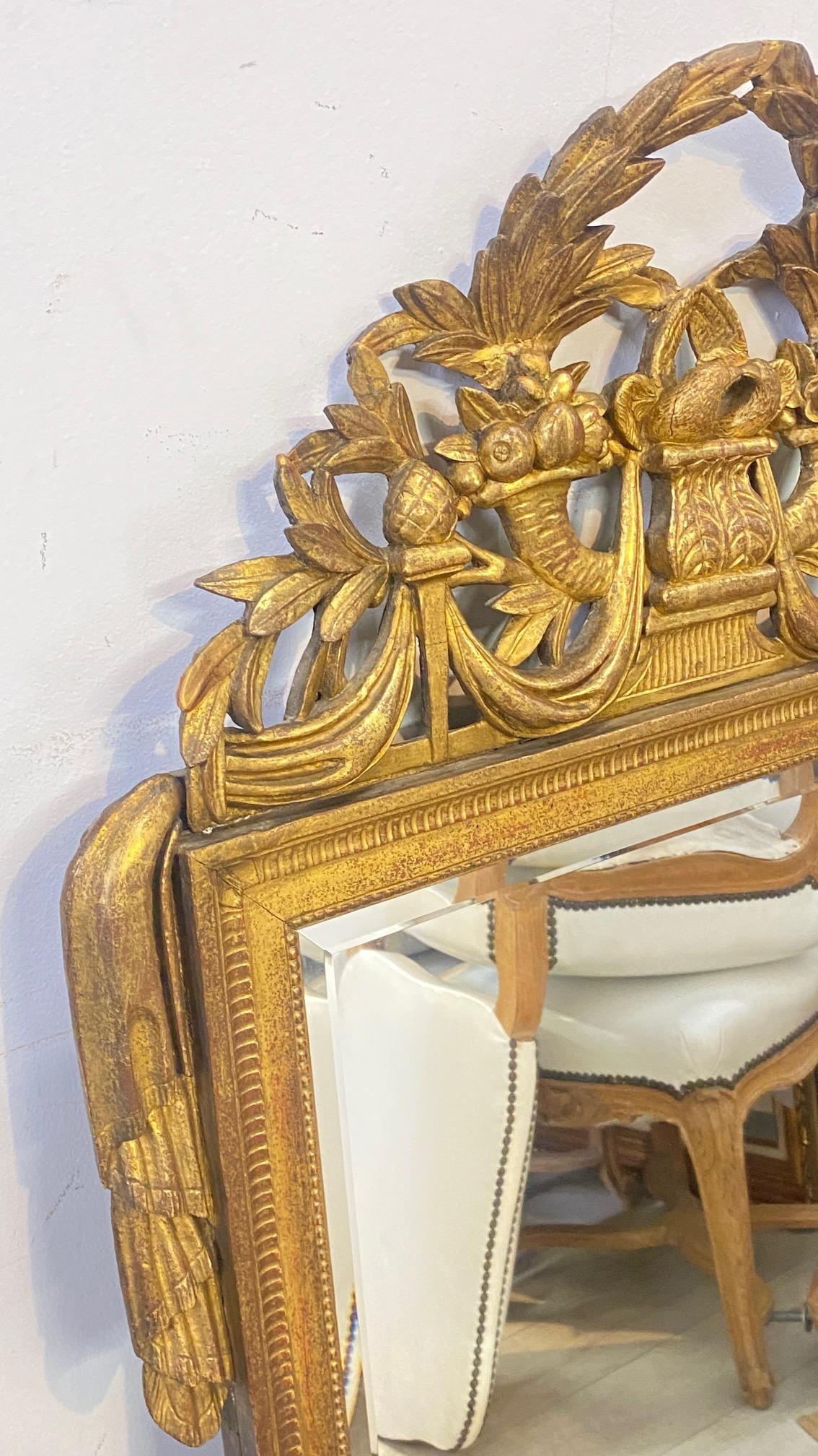 Giltwood Early 18th Century French Carved and Gilded Baroque Mirror For Sale