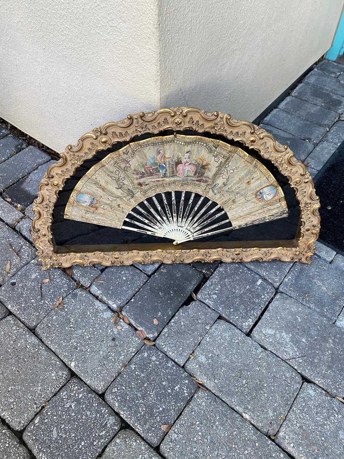 Early 18th century French fan in gilt display case.