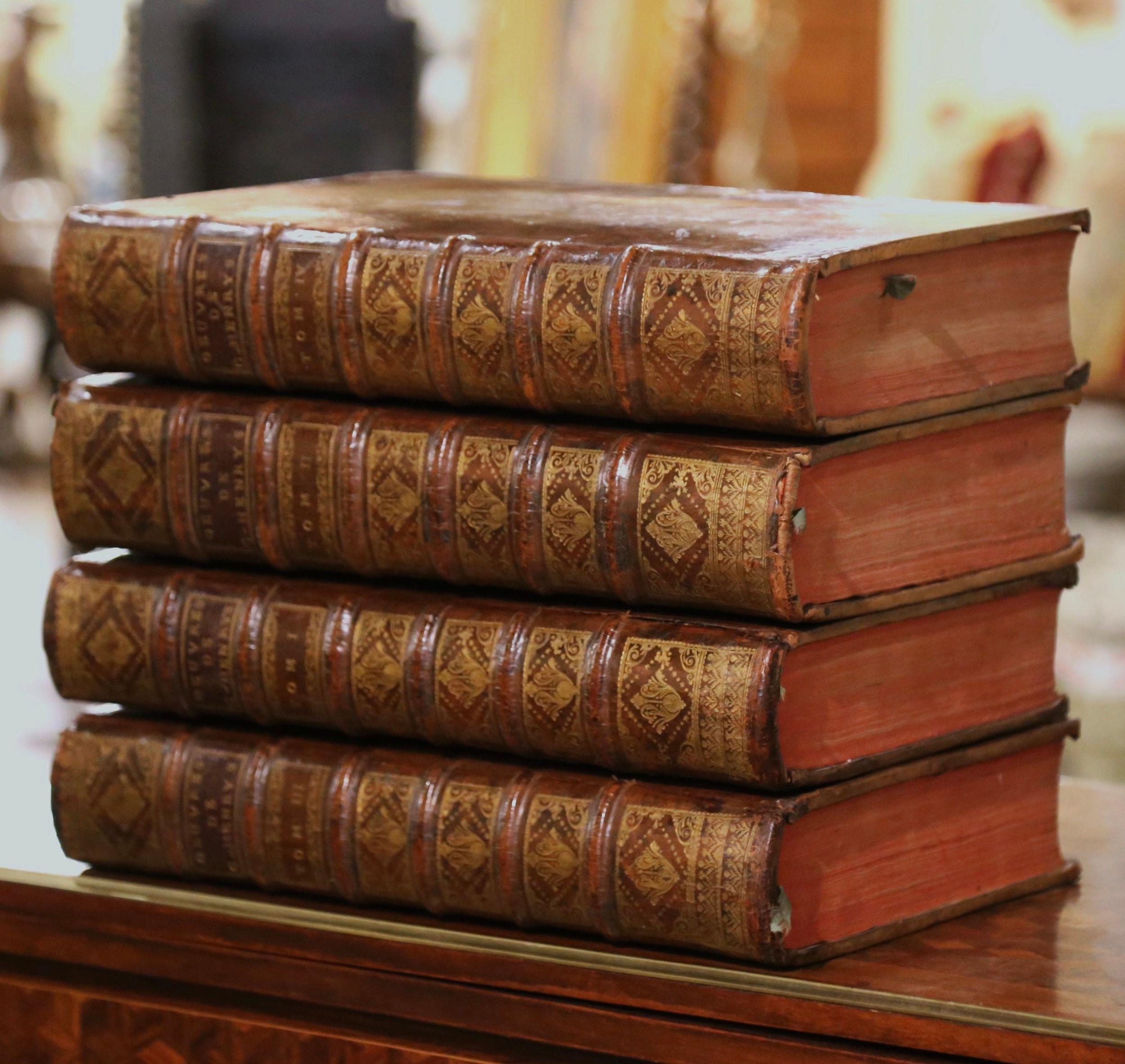 Decorate a library, an office, or a coffee table with this complete suite of large antique books. Dated MDCCXXXVIII, or 1738, and printed in Paris during the reign of King Louis XV, these important leather bound books with gilt tooling called
