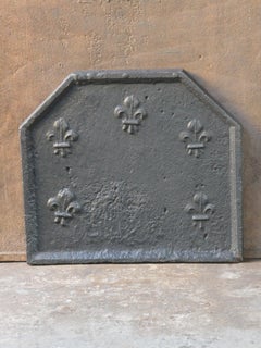 Plaque de cheminée / dosseret Louis XIV du début du 18ème siècle avec Fleurs de Lys