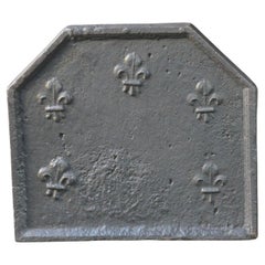 Plaque de cheminée / dosseret Louis XIV du début du 18ème siècle avec Fleurs de Lys