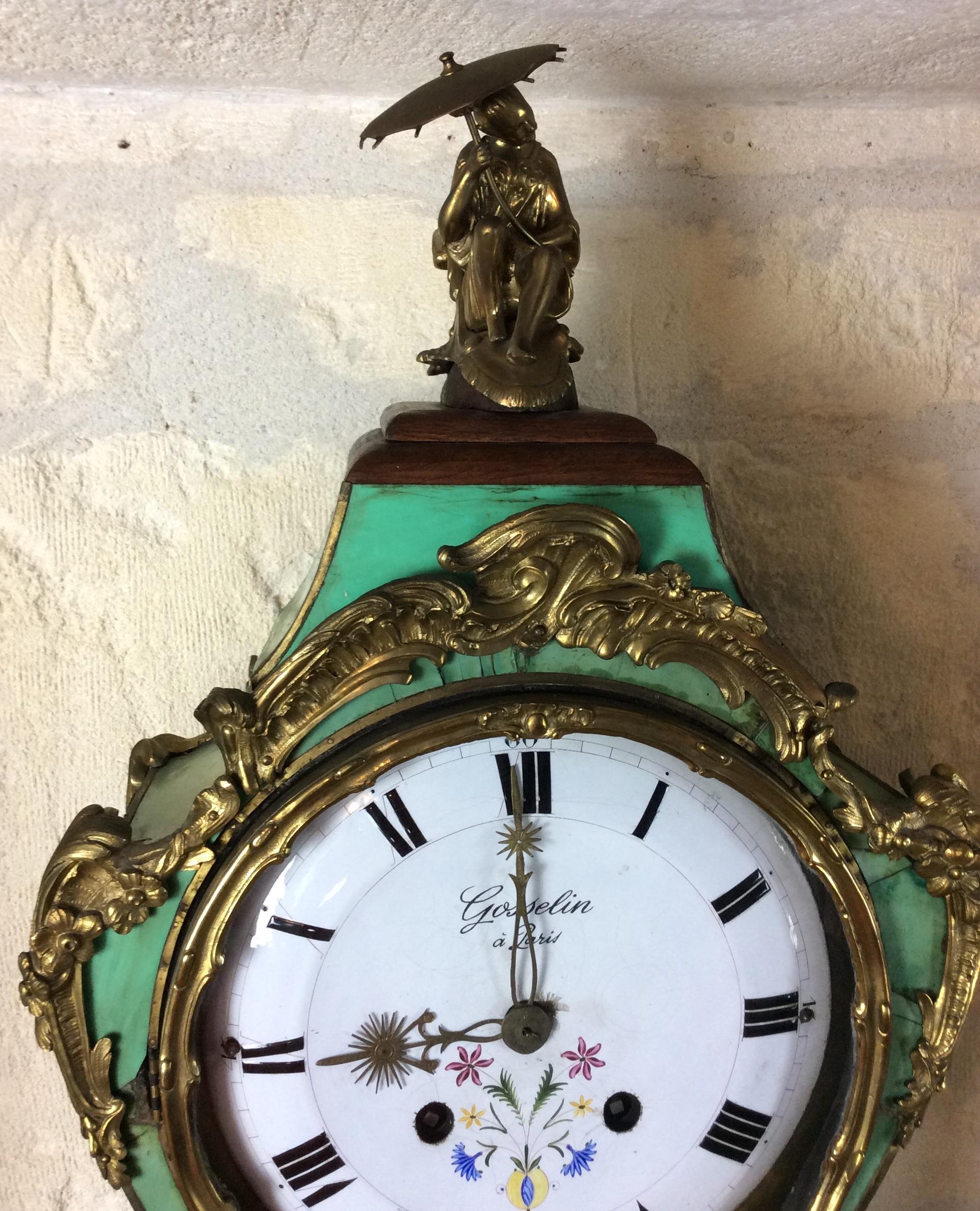 A very fine Early 18th century French Louis XV period corne verte (green horn) and ormolu mounted cartel or wall clock. The impressive cartel rests on its original socle - wall mounted base. Signed on the original white enamel dial with hand painted